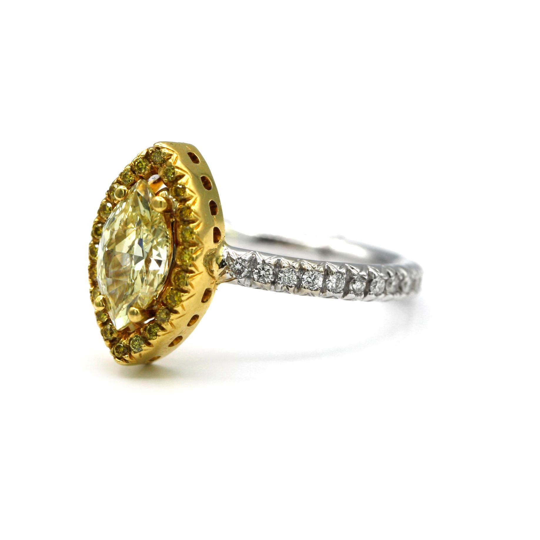 This 18 Karat gold ring features a 1.01 carat marquise shape yellow diamond (GIA certificate # 510237096) with W-X color and SI1 clarity.
The center diamond is surrounded by 22 yellow diamonds with a weight of 0.26 carats and 35 white diamonds with