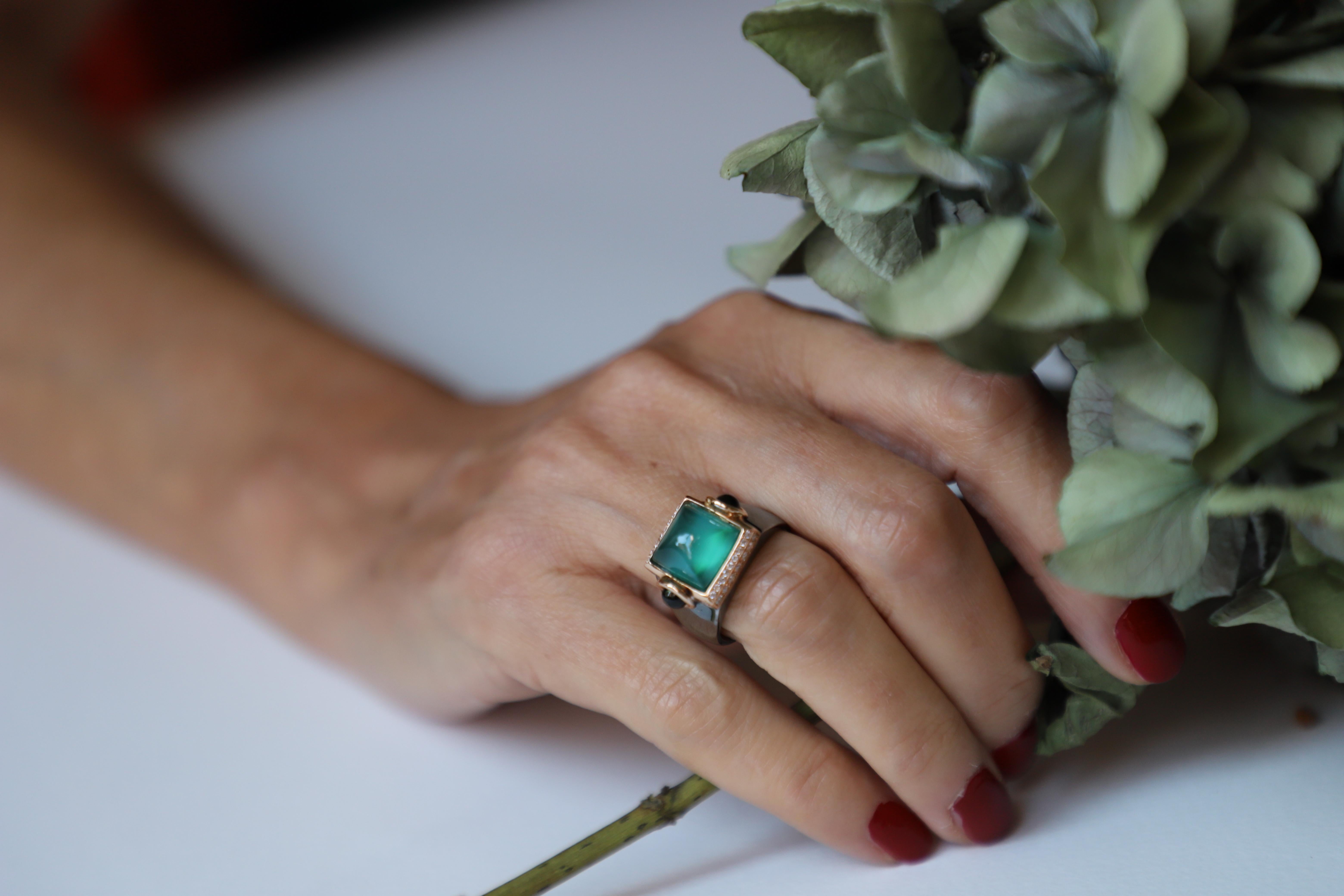 Presenting Rossella Ugolini's Castle Collection: a stunning blend of Art Deco style and Italian heritage. This 18 karat Gold ring, adorned with 0.20 karat White Diamonds, showcases a captivating combination of Sugarloaf cut Green Agate and Green