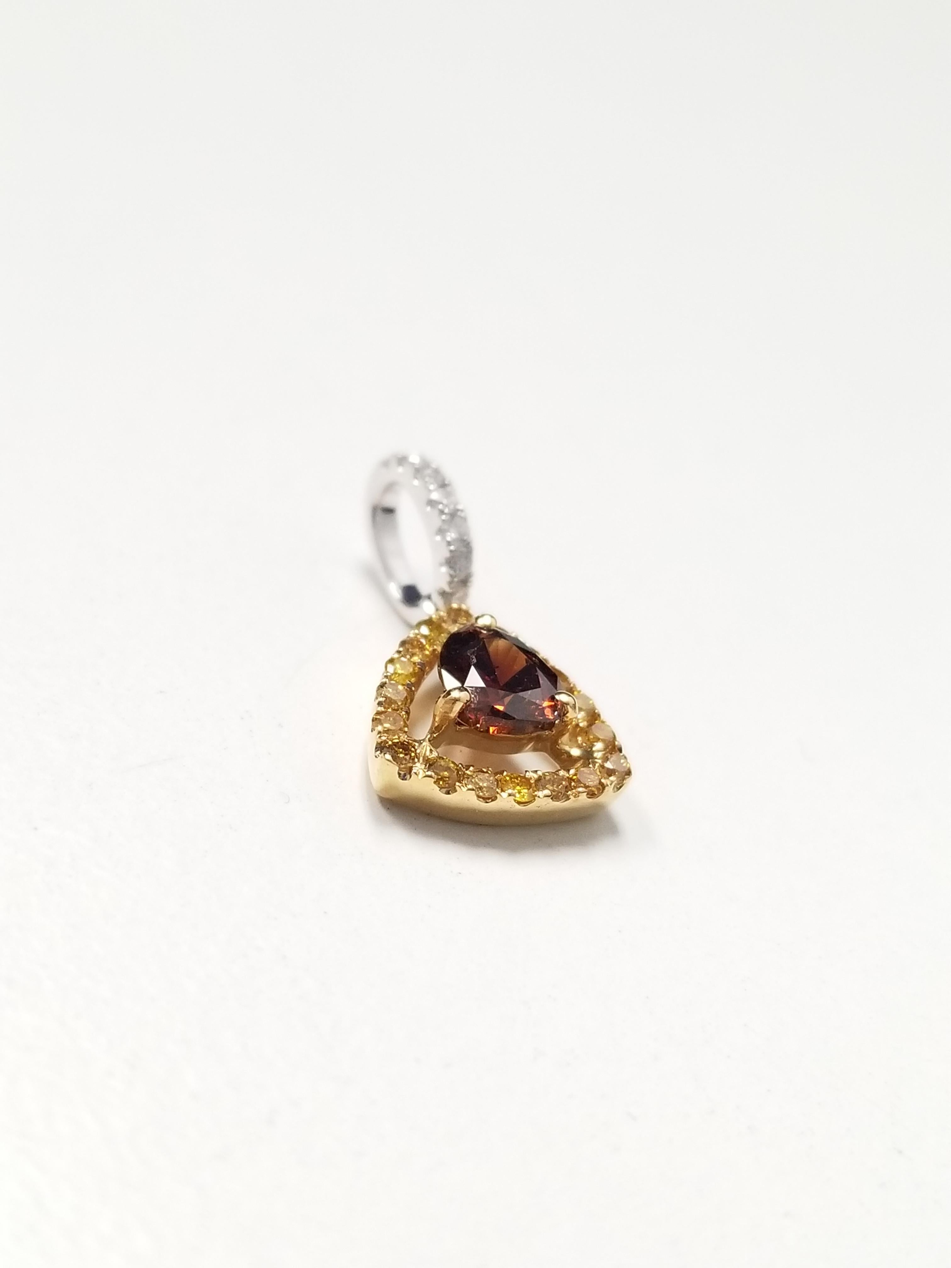 Gorgeous Natural Fancy Brown Reddish Orange Red face up heart shape pendant, unique color combination weighing 0.37ct with GIA color grading, surrounded by mixed fancy yellow and white diamond round brilliant cut diamonds. set in 18k white gold
