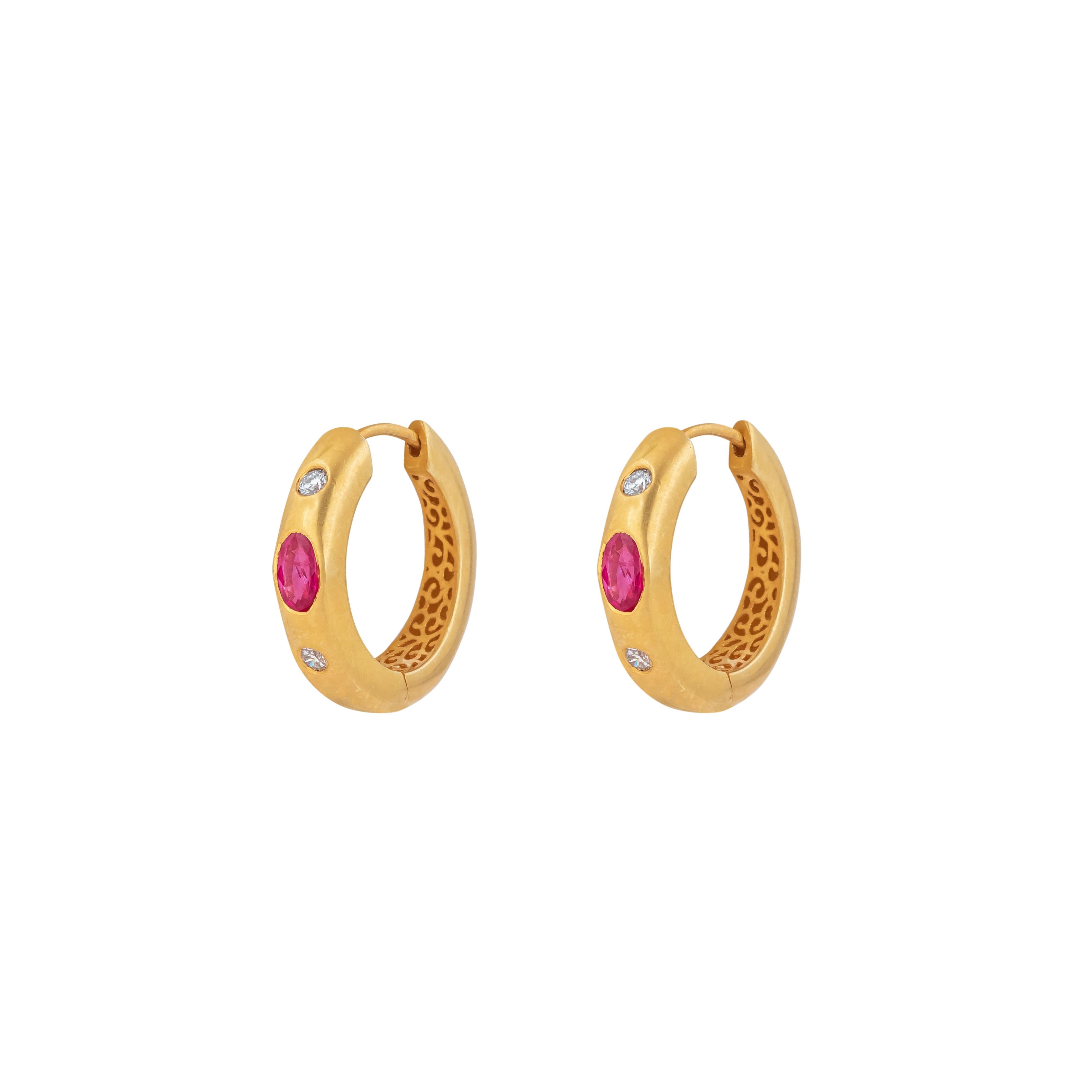Discover the refined elegance of the 18 Karat Gold 0.69 Carat Diamond and Ruby Hoop Earrings. Each pair is uniquely crafted and curated, blending luxury with timeless design, perfect for adding a touch of sophistication to any ensemble.

The