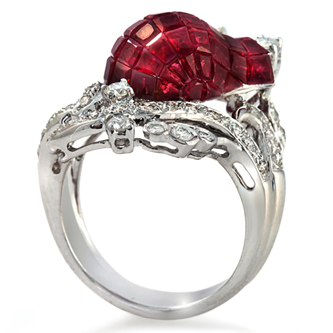 Top: 30 mm
Band Width: 4.5 mm
Metal: 18K White Gold
Size: 6
Hallmarks: 18K
Total Weight: 9.7 Grams
Stone Type: 0.92 Ct Diamonds VS2 G-F & 11.58 CT Natural Ruby
Condition: New
Stock Number: R2714
Estimated Retail Price: 14915