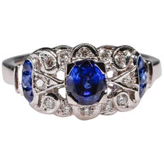 18 Karat Gold 0.93 Carat Art Deco Style Blue Sapphire Diamond Halo Ring