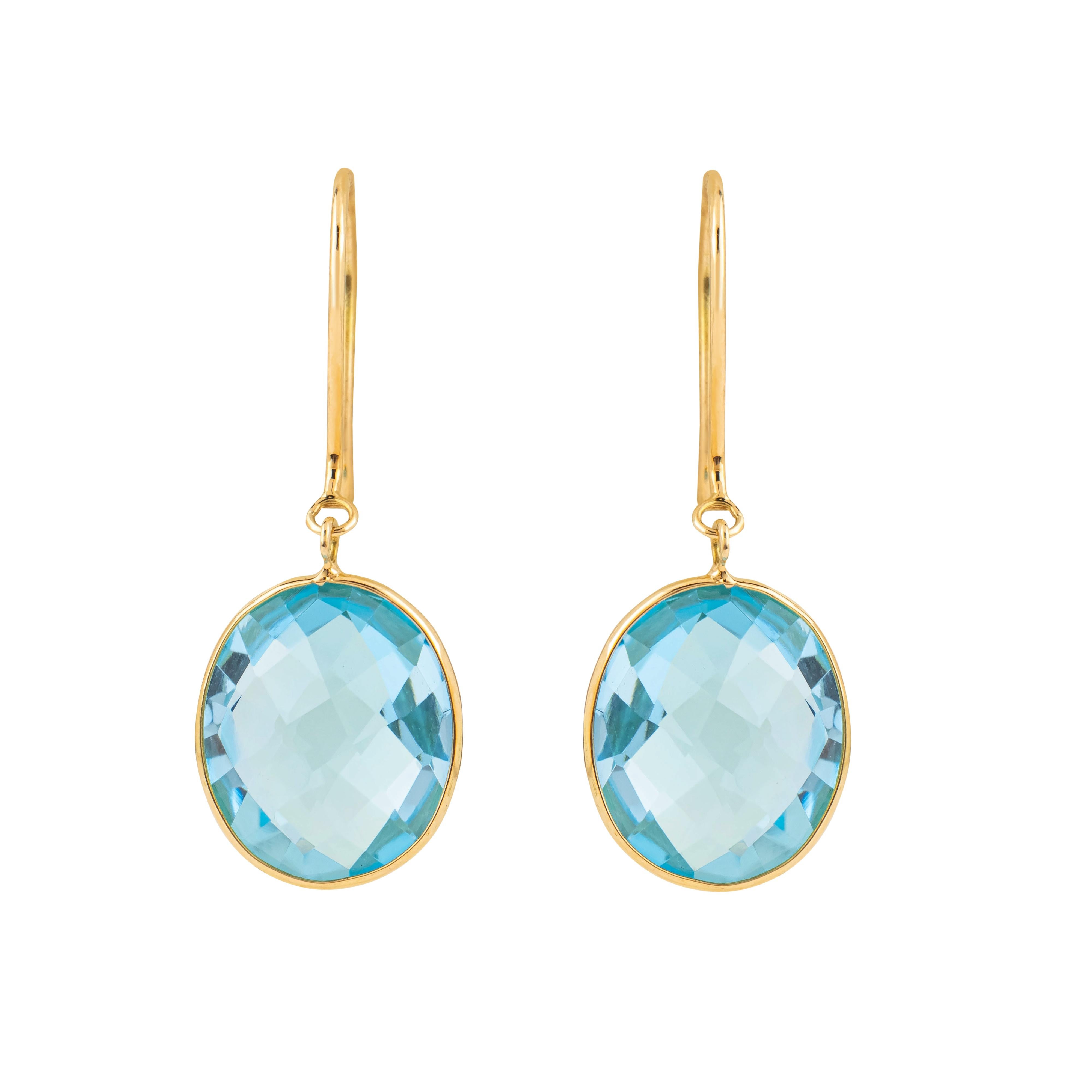 Exuding a sense of elegance, the 18 Karat Gold 10 Carat Blue Topaz Drop Earrings are a timeless addition to any jewelry collection. These earrings are distinguished by their meticulously crafted design, featuring striking blue topaz gemstones that