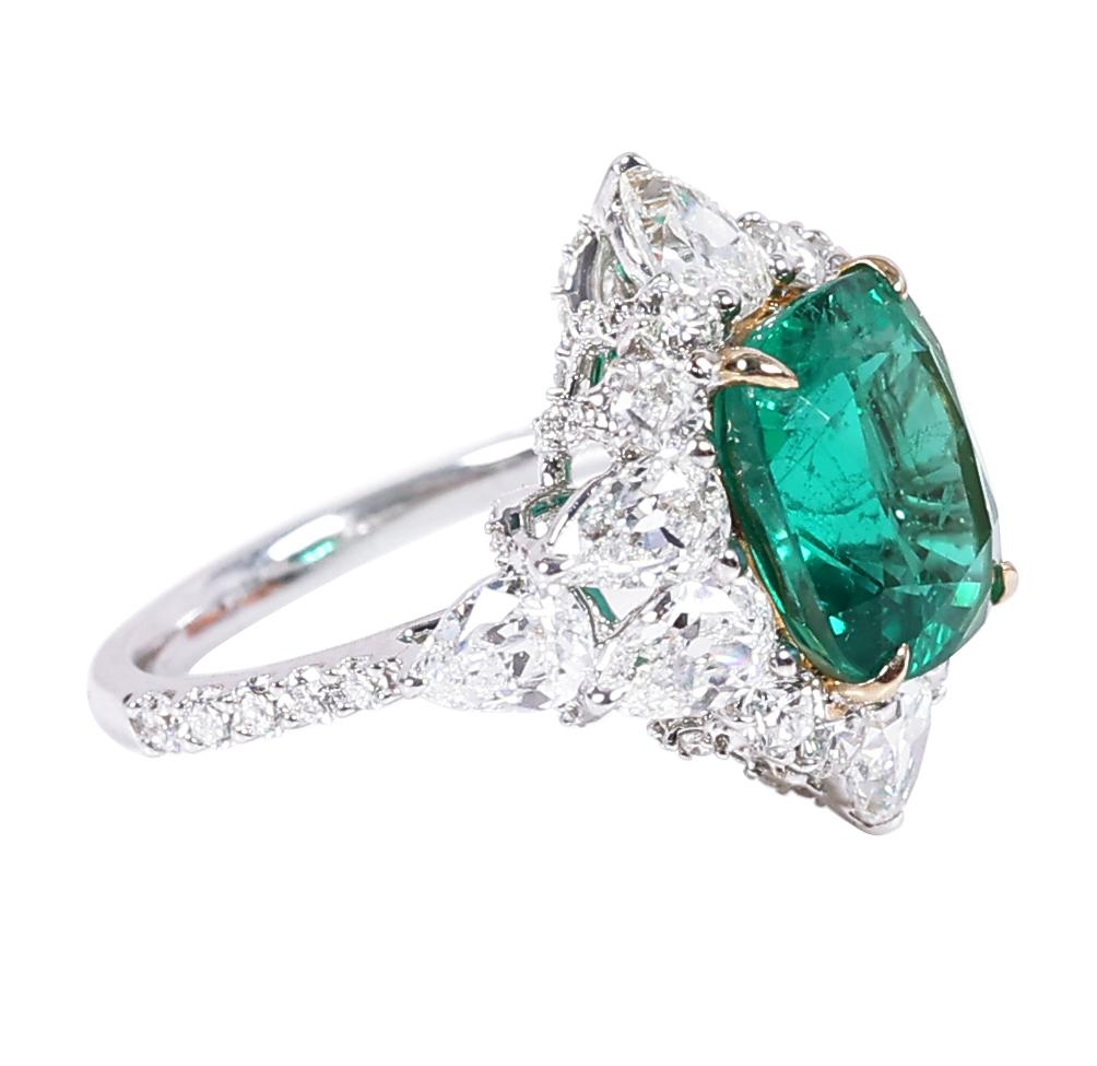18 Karat White Gold 10.60 Carat Natural Emerald and Solitaire Diamond Cocktail Ring

This exquisite vivid green emerald diamond ring is exceptional. The leveled-up solitaire cushion emerald is incredibly set in yellow gold eagle prong setting and