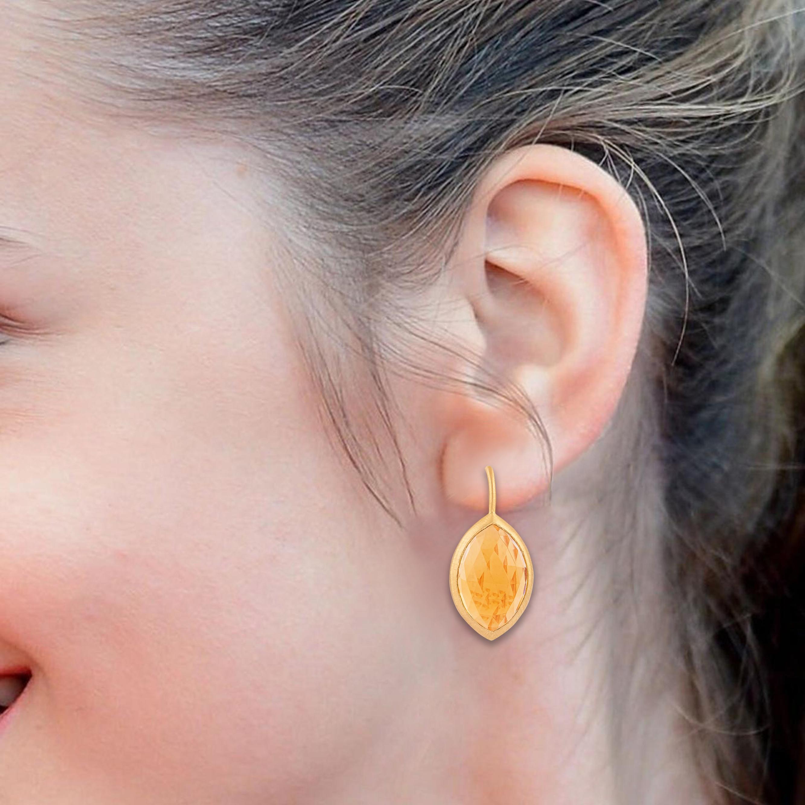 Crafted with precision and passion, our 18 Karat Gold 11 Carat Golden Topaz Drop Earrings embody elegance and sophistication. Each pair is a masterpiece of artistry, meticulously designed to capture the essence of timeless beauty.

At the heart of
