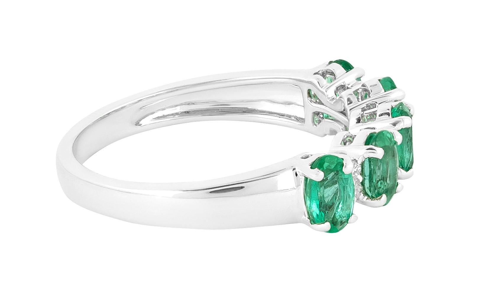 Crafted with unparalleled artistry, the 18 Karat Gold 1.13 Carat Diamond and Emerald Cluster Statement Ring stands as a captivating testament to refined elegance. This exquisite ring merges the sparkling allure of diamonds with the verdant allure of