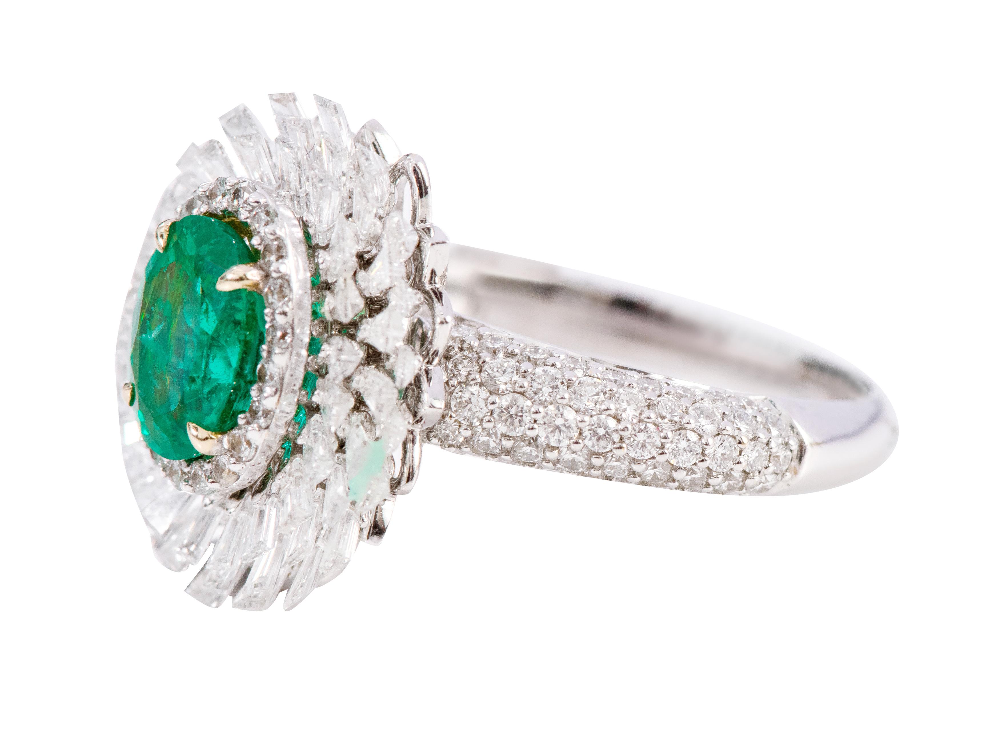 18 Karat White Gold 1.15 Carat Natural Emerald and Diamond Cluster Statement Ring

This impressive cocktail vivid green emerald and diamond ring is prolific. The ring sets itself apart with the exquisite oval emerald solitaire surrounded first by a