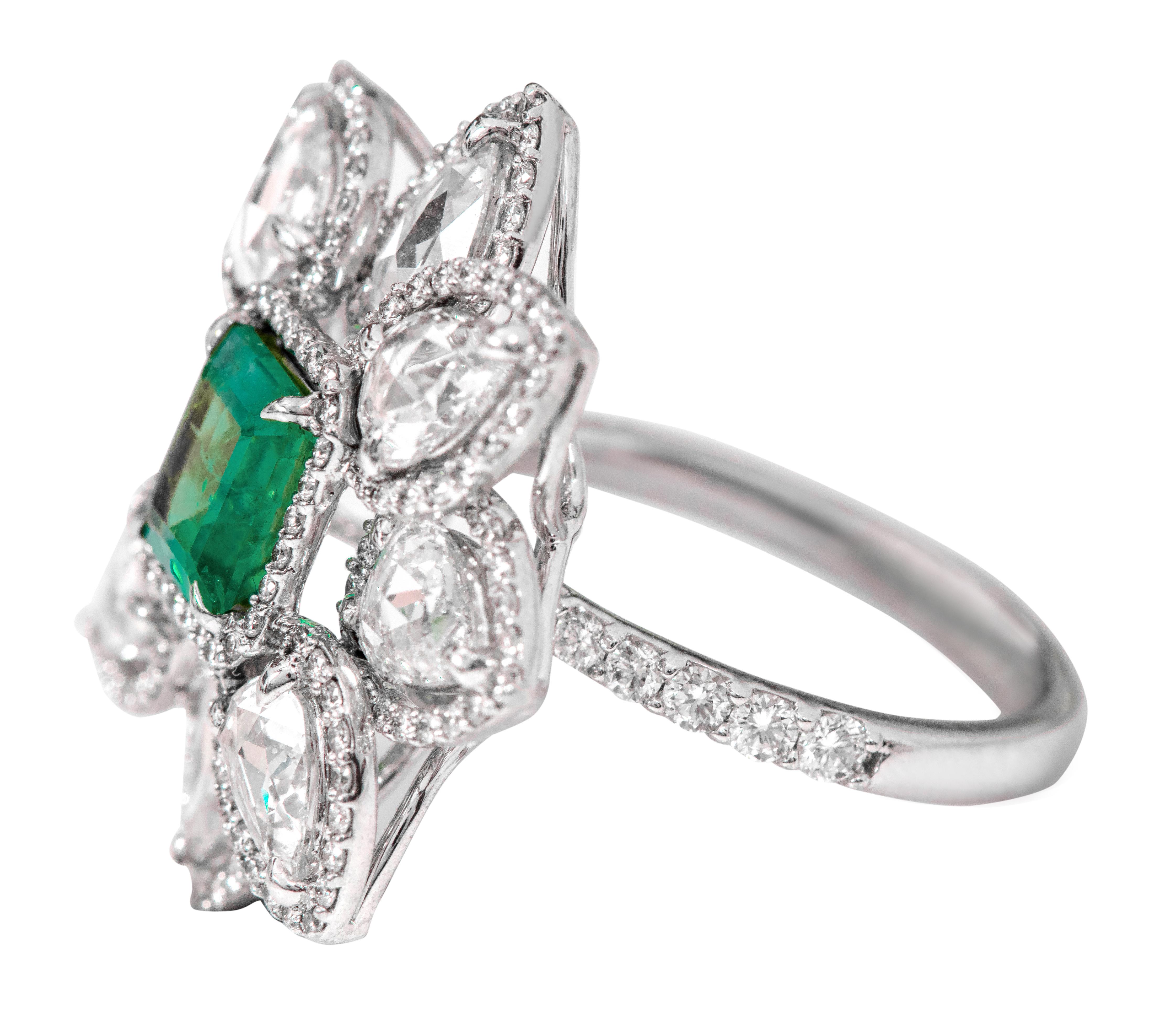 18 Karat White Gold 1.25 Carat Natural Emerald and Diamond Cluster Contemporary Ring 

This impressive vibrant green emerald and diamond rose-cut cocktail designer ring is majestic. The exquisite solitaire emerald cut emerald with a leveled down
