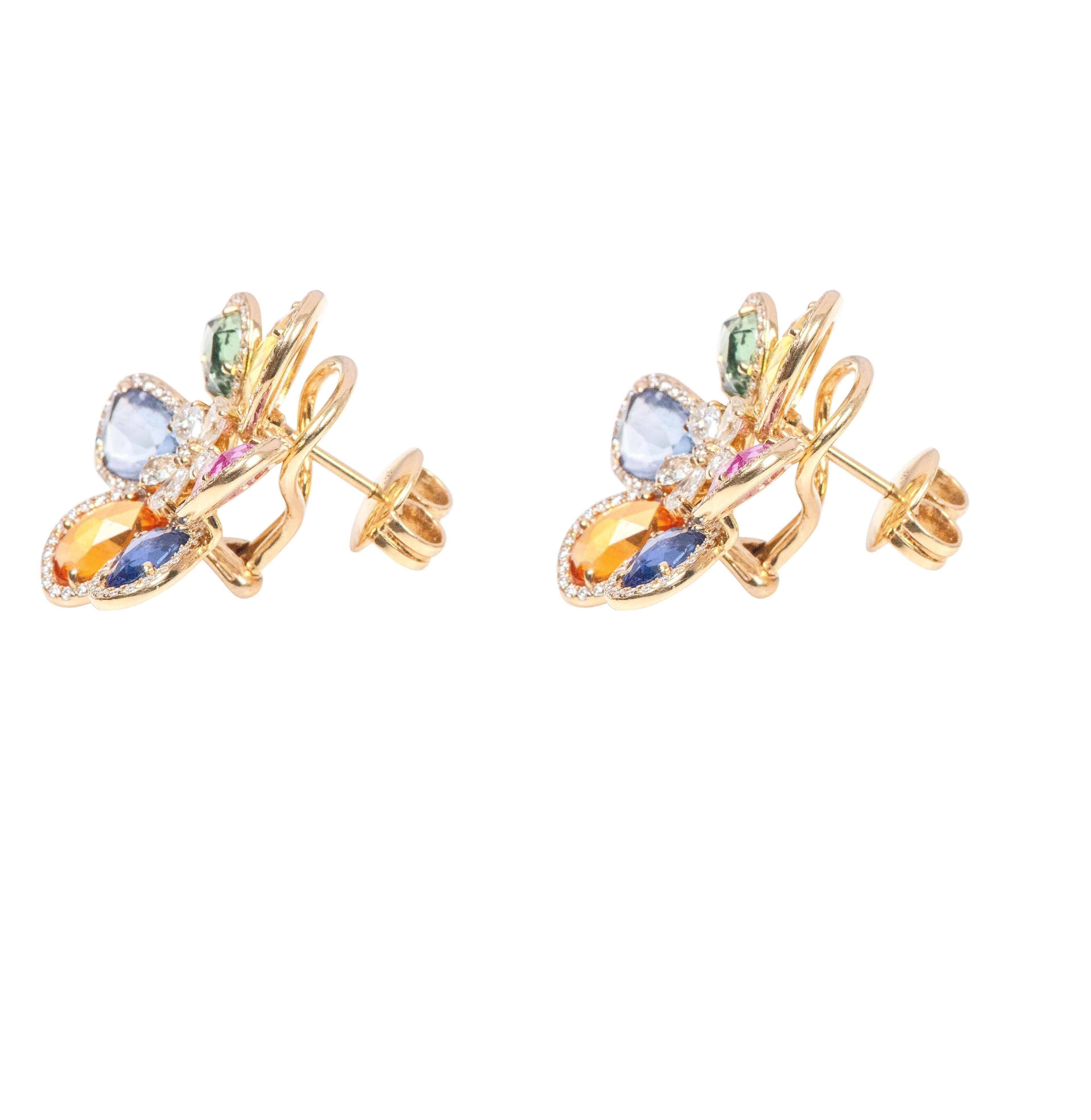 18 Karat Gold 12.51 Carat Diamond and Sapphire Flower Stud Earrings 

a perfect fusion of elegance and artistic curation. Each earring is a unique masterpiece, meticulously designed and crafted to showcase a captivating flower motif composed of