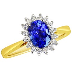 18 Karat Gold 1.28 Carat Natural Oval Blue Sapphire Ring with 16 VS/G Diamonds