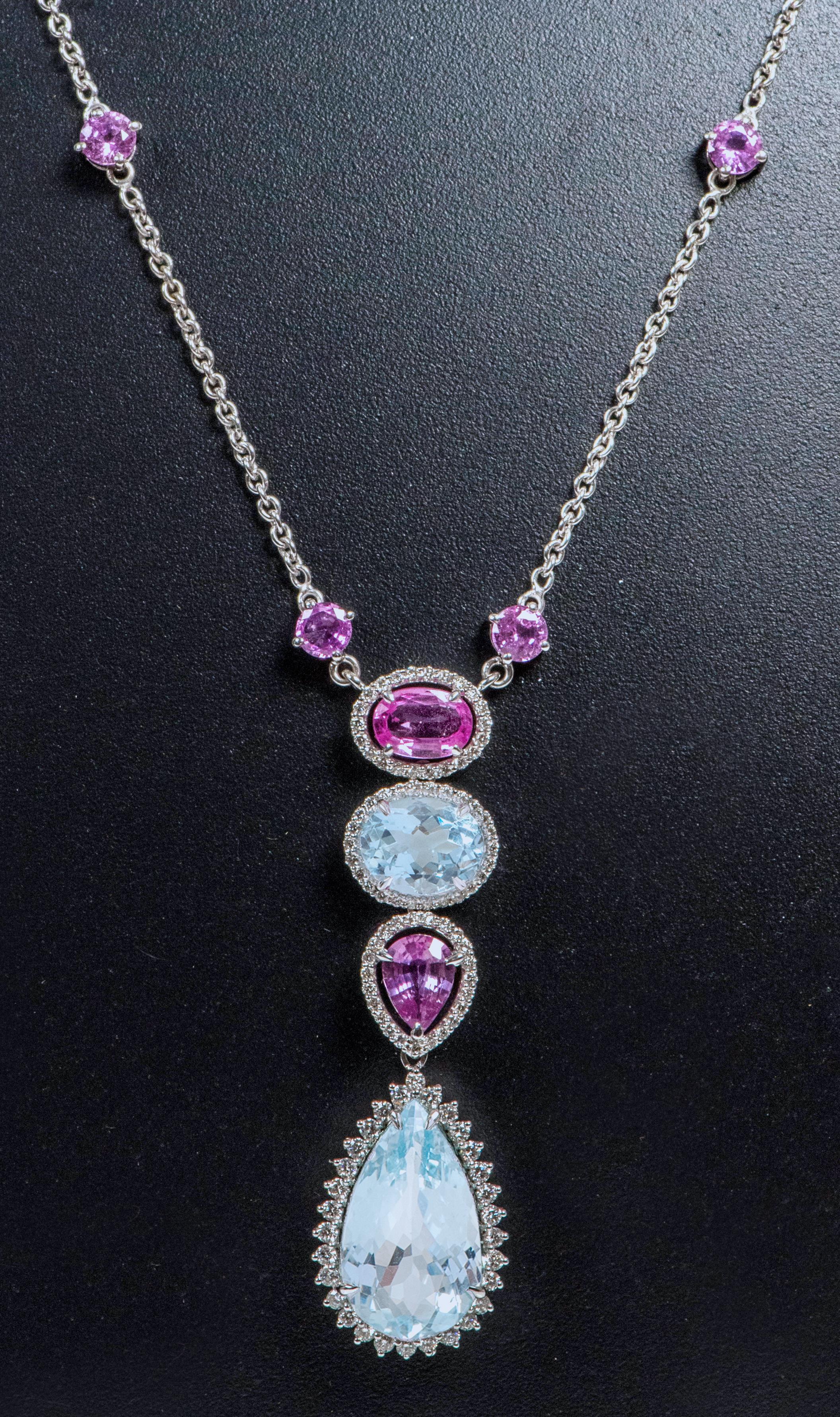 18 Karat White Gold 12.81 Carats Aquamarine, Pink Sapphire, and Diamond Pendant Drop Necklace 

This exemplary contemporary vibrant pink sapphire, santa marina aquamarine, and diamond cluster drop necklace is mesmerizing. The necklace is designed