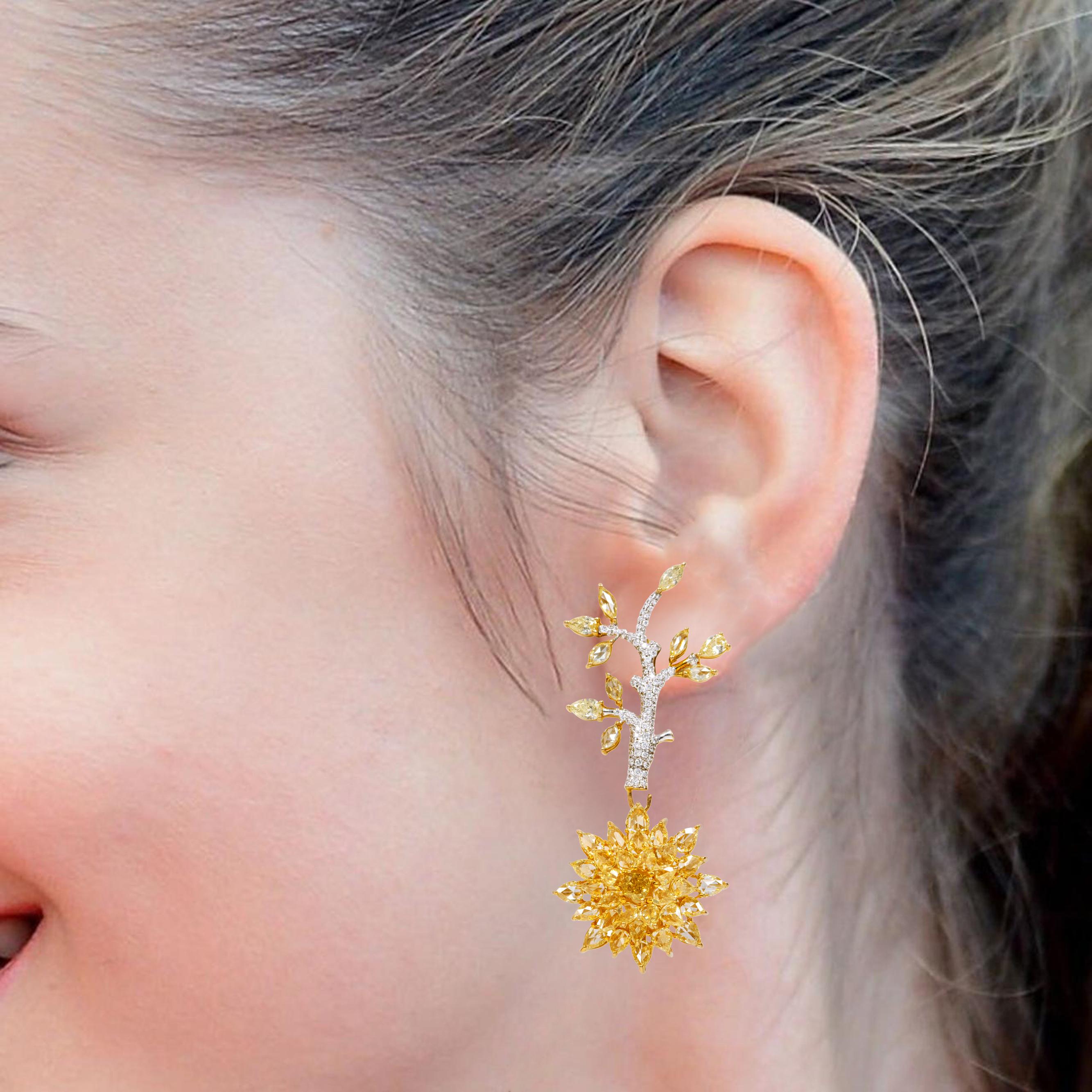 18 Karat Gold 12.86 Carat Fancy Yellow and White Diamond Two-Way Dangle and Stud Earrings

Immerse yourself in the allure of our 12.86 Carat Fancy Yellow and White Diamond Two-Way Dangle and Stud Earrings—an extraordinary pair that harmoniously