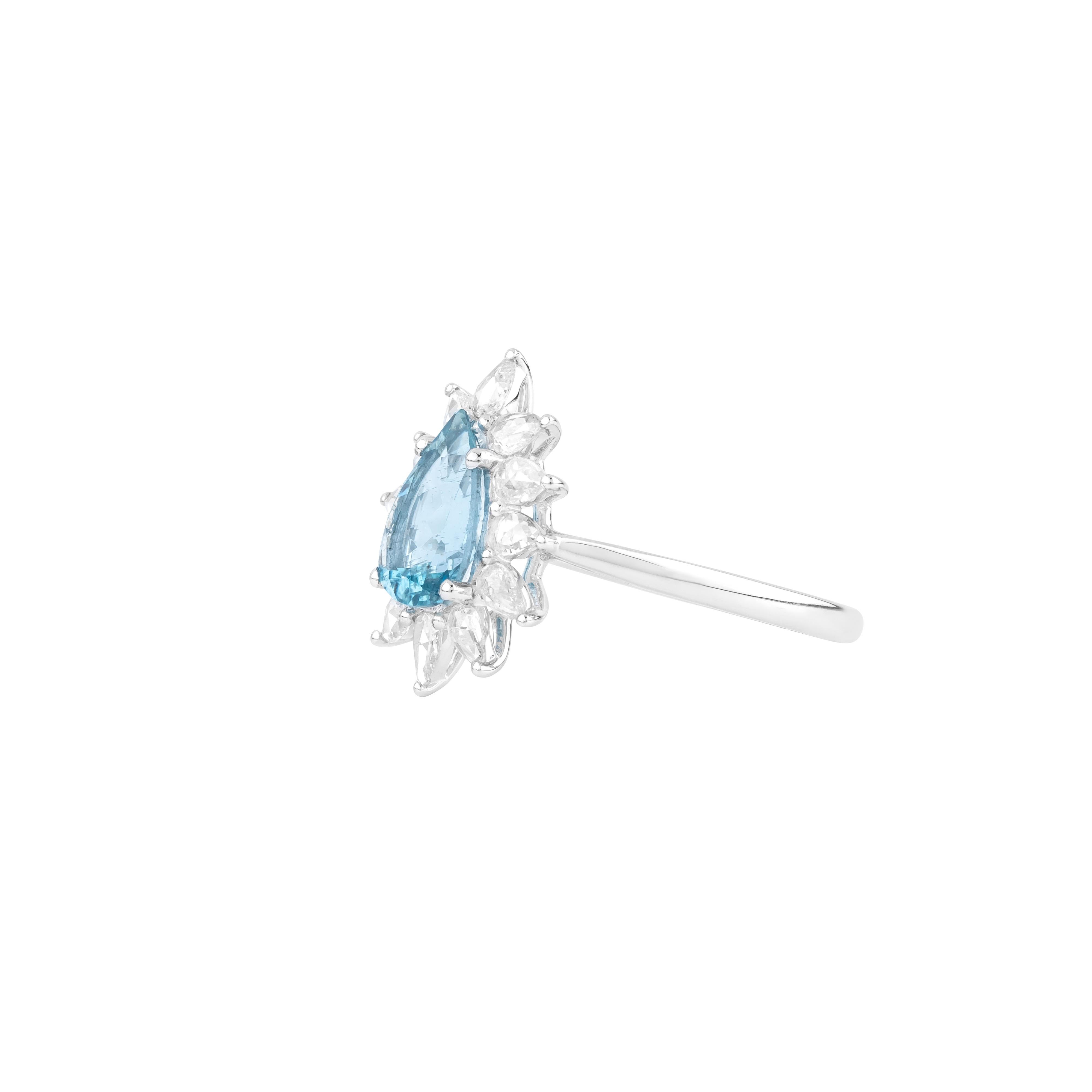 A masterful expression of elegance and artistry, the 18 Karat Gold 1.36 Carat Diamond and Aquamarine Fashion Ring presents a captivating interplay of gemstones and meticulous design. At the heart of this piece lies a beautifully faceted aquamarine,