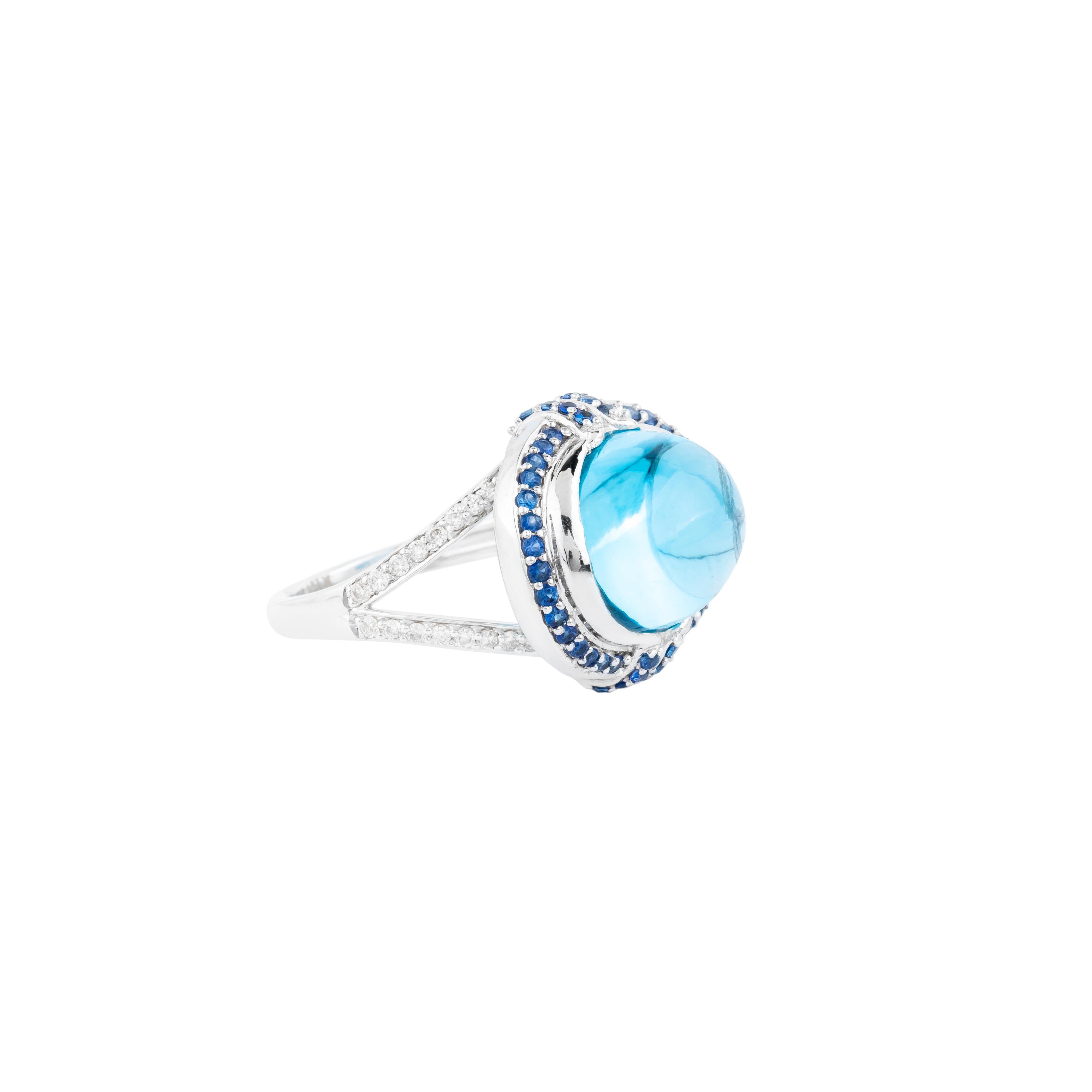 Exquisite craftsmanship meets bold design in this 18 Karat Gold Color Stone and Diamond Cocktail Ring, featuring a remarkable 14.4-carat center stone. The gemstone’s expertly cut facets radiate brilliance, creating a captivating focal point that