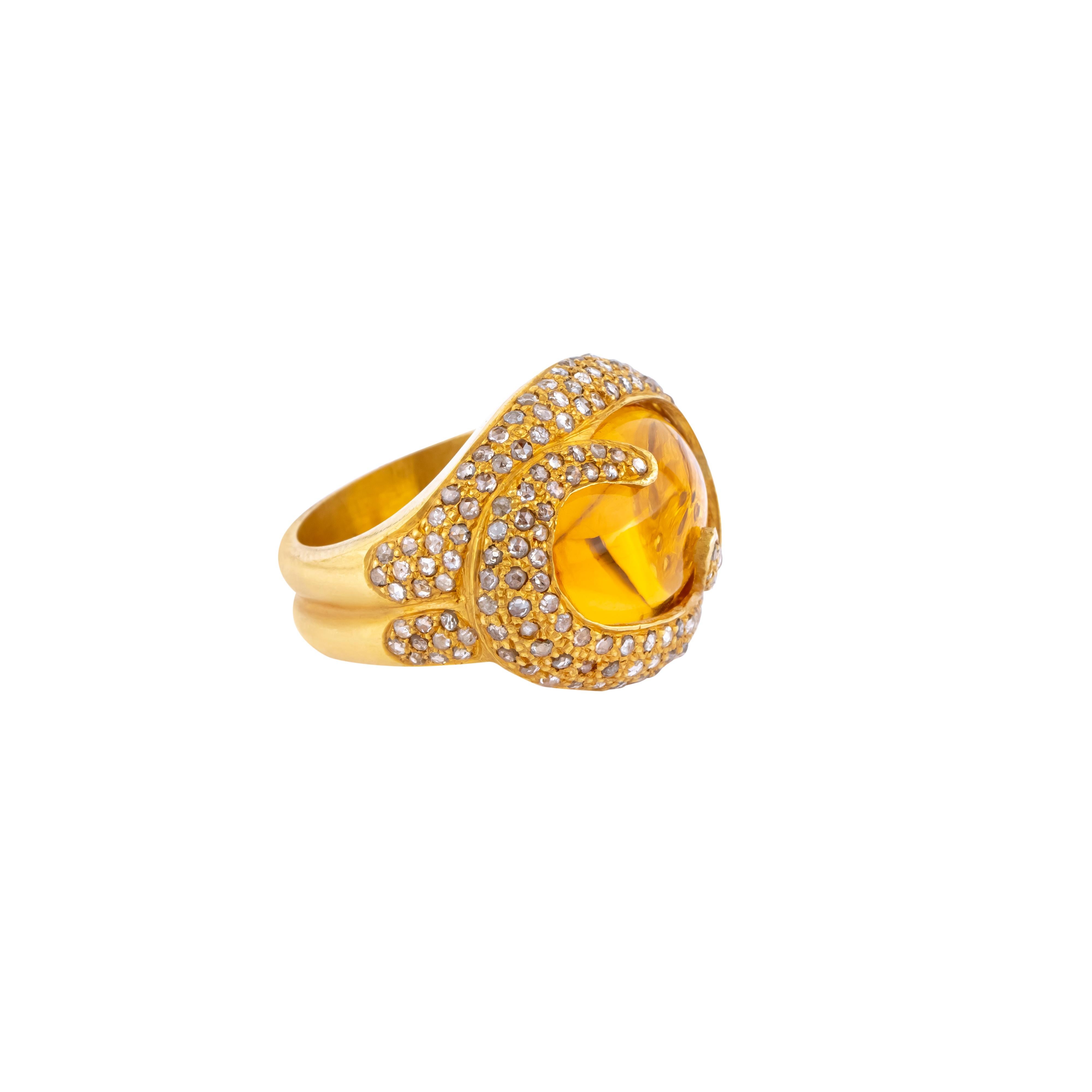 The 18 Karat Gold cocktail ring showcases a resplendent 16.72-carat golden topaz as its central element, a gemstone celebrated for its captivating brilliance and depth. Masterfully faceted to maximize its light-refracting properties, the topaz
