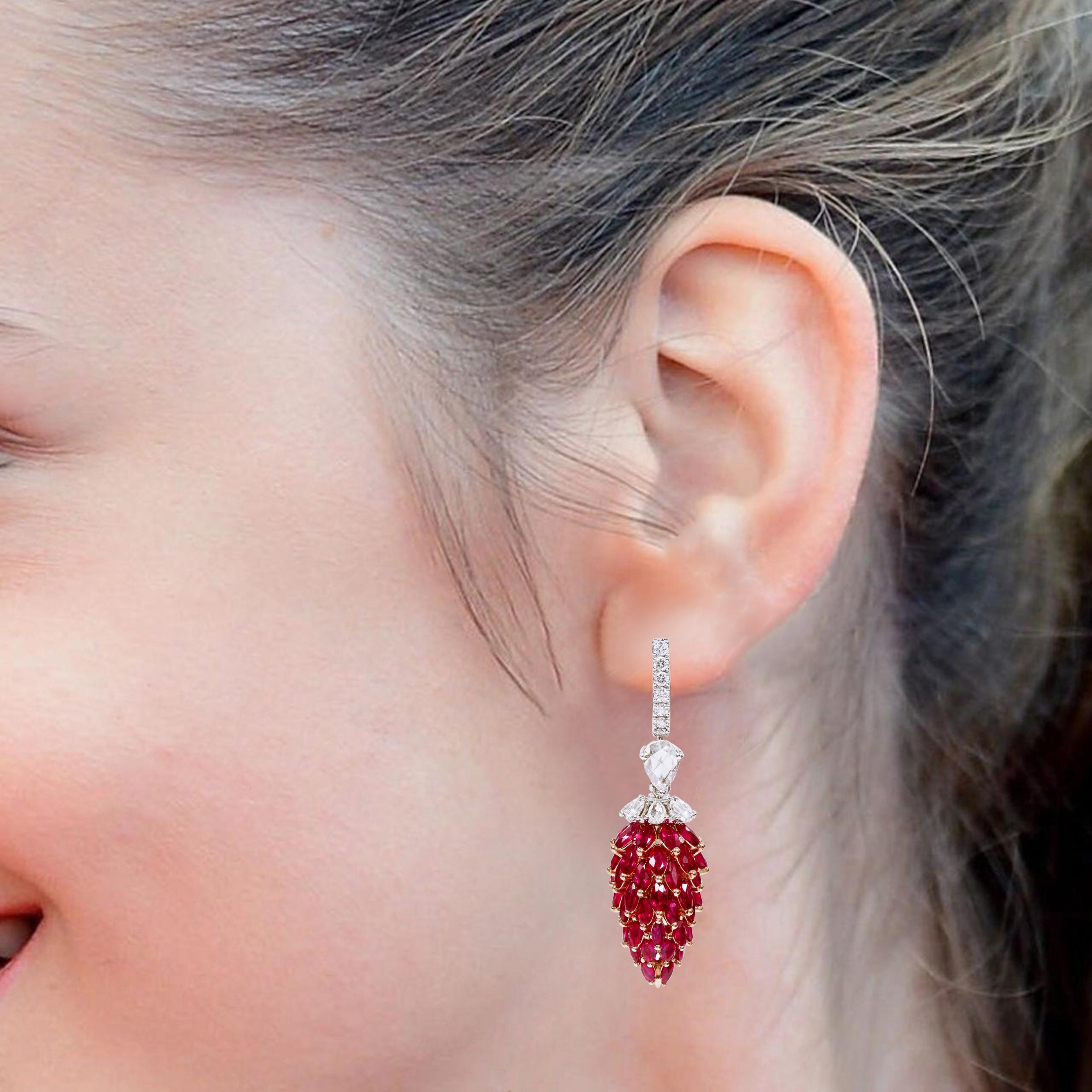 18 Karat Gold 16.77 Carat Pigeon-Blood Ruby and Diamond Drop Earrings

Introducing a pinnacle of opulence and rarity - our 18 Karat Gold 16.77 Carat Pigeon-Blood Ruby and Pear-Cut Diamond Drop Earrings. These earrings are a breathtaking embodiment