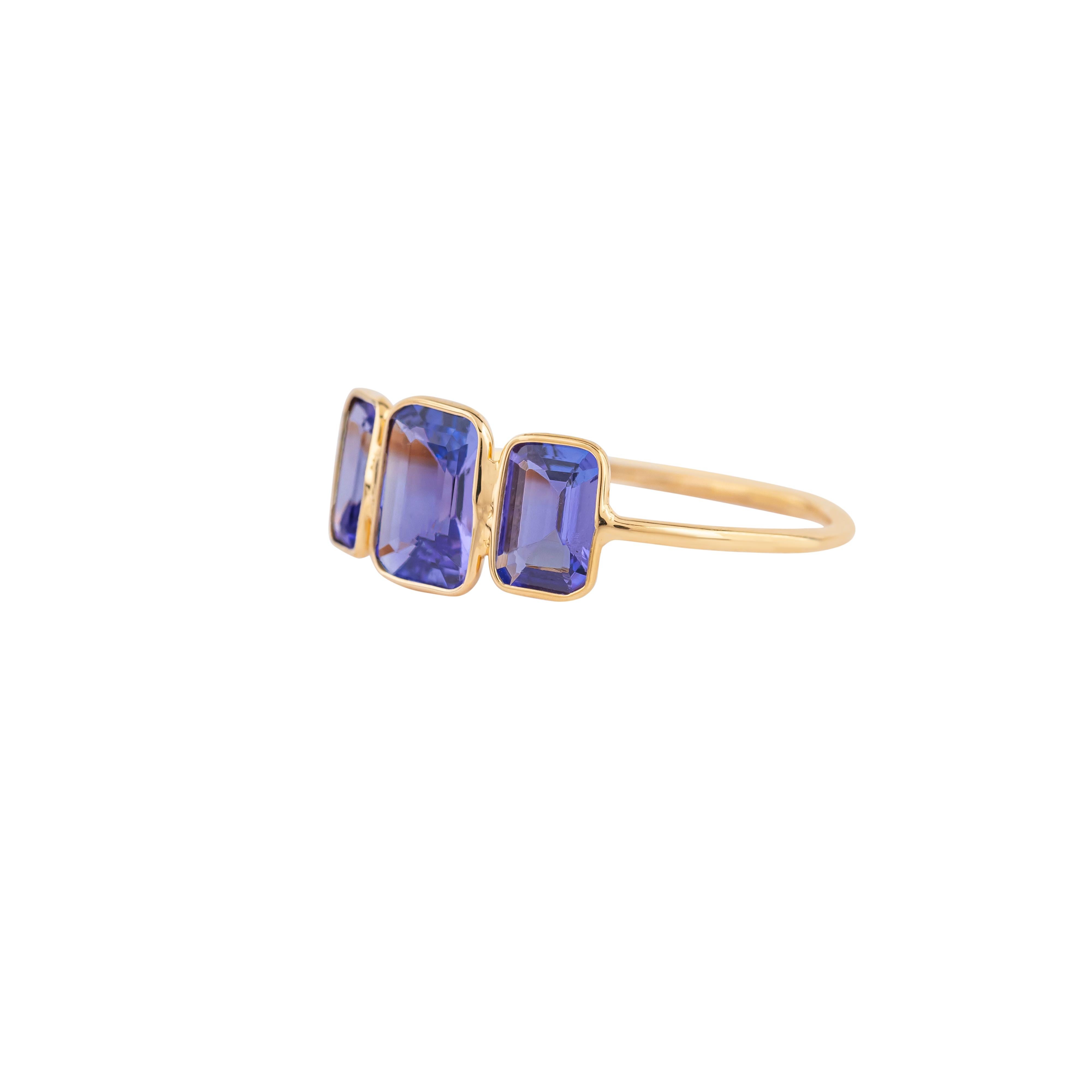 Modern 18 Karat Gold 1.7 Carat Tanzanite Three Stone Ring For Sale