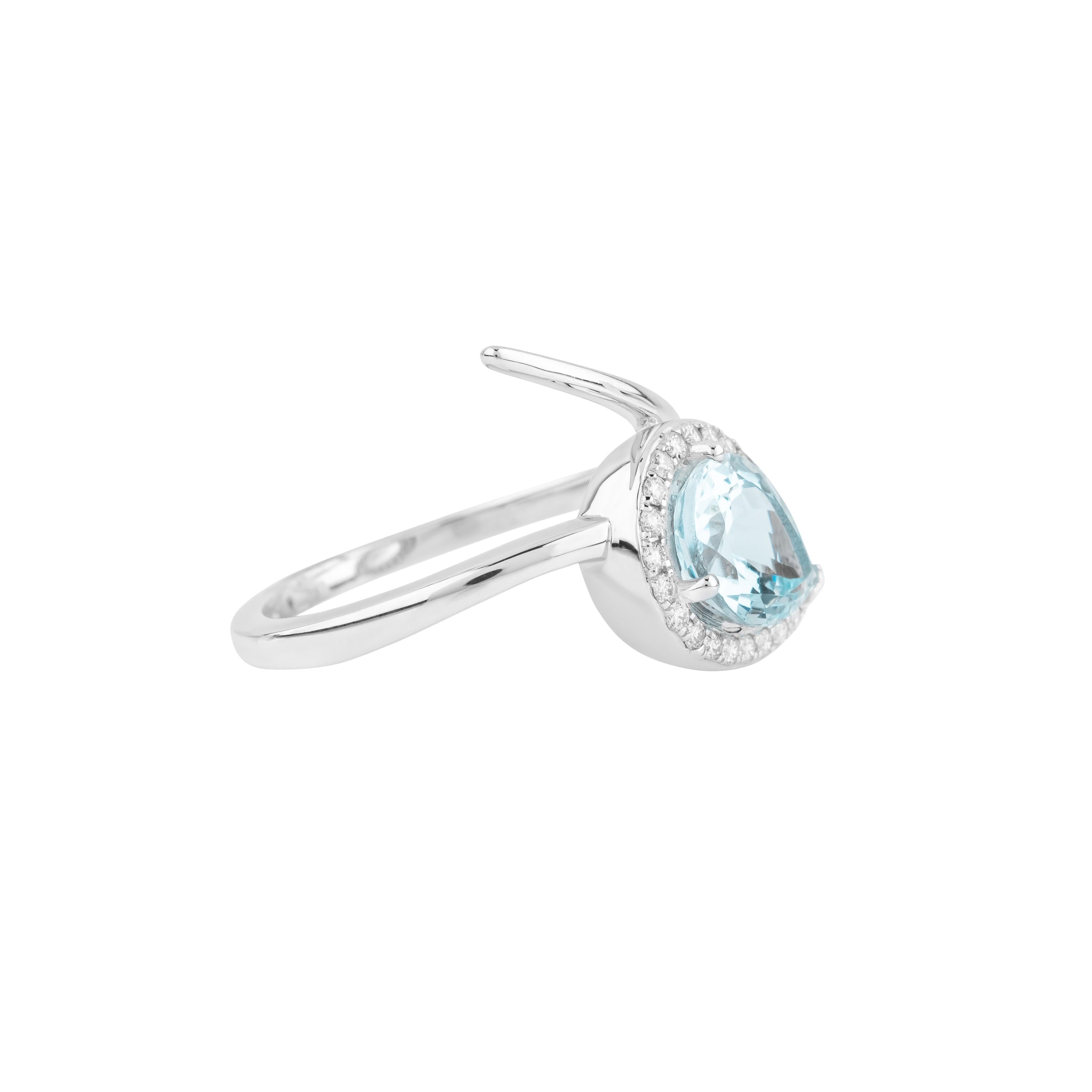 A captivating blend of timeless elegance and modern artistry, the 18 Karat Gold 1.82 Carat Diamond and Aquamarine Cocktail Ring is designed to leave a lasting impression. At the heart of this exquisite piece lies a 1.82 carat aquamarine, carefully
