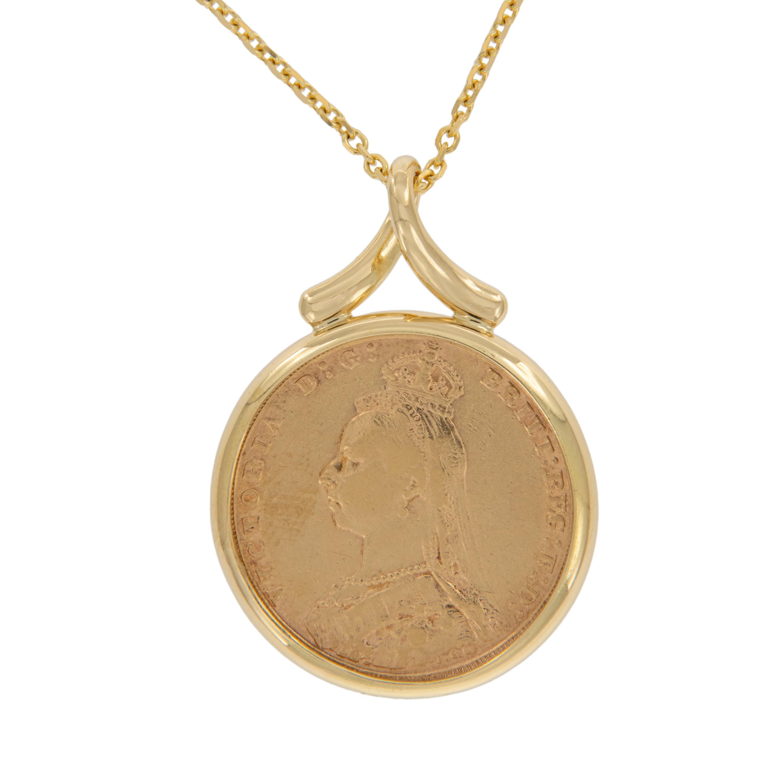 Enjoy a piece of British gold coin history! This 1893 Gold Sovereign Queen Victoria veiled head coin is framed in 18k yellow gold and suspends from a ribbon-style bail on an 18 karat yellow gold 16-inch chain. Pendant measures 42mm tall x 32mm wide.