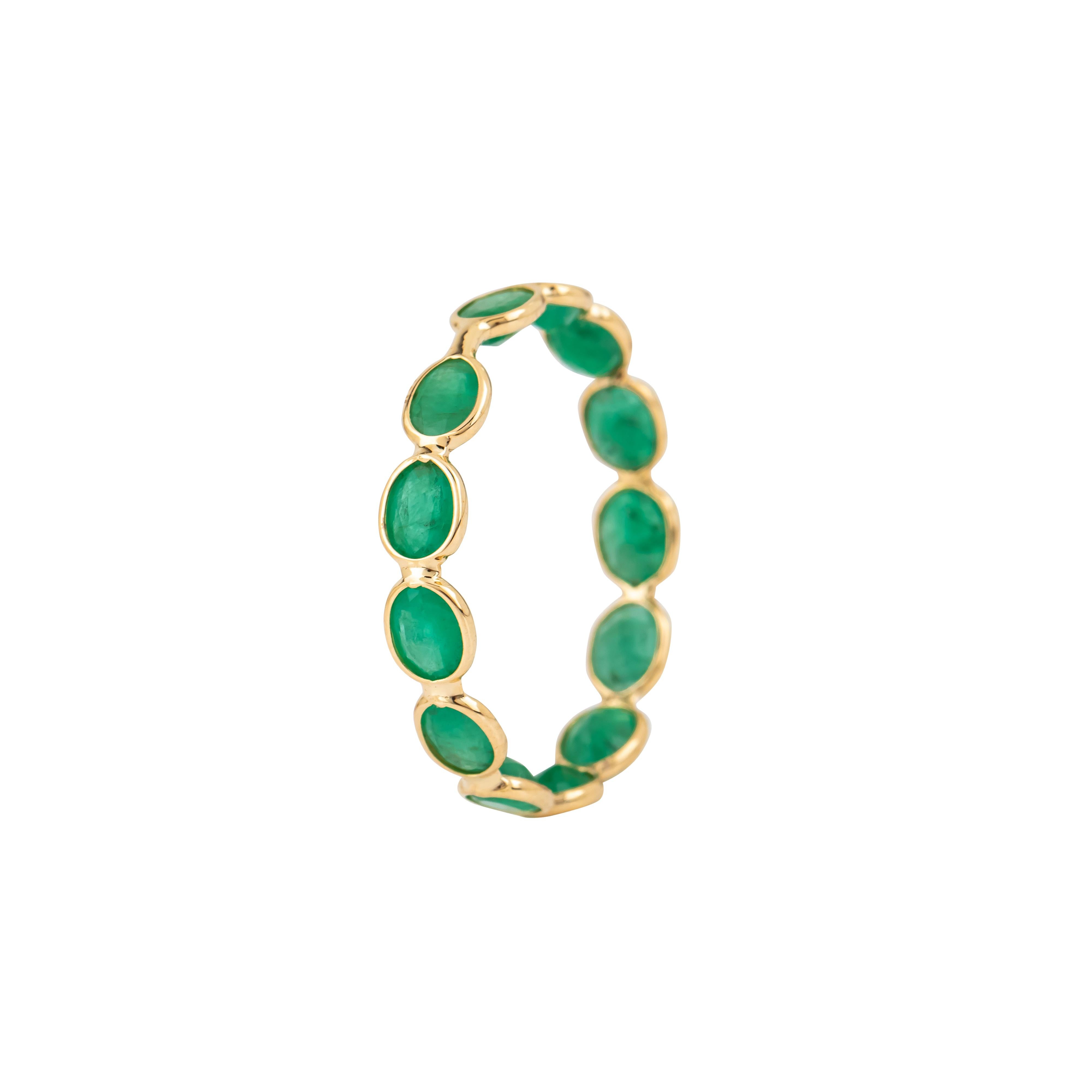 A stunning embodiment of refined craftsmanship, this 18 Karat Gold 1.9 Carat Emerald Band Ring is a celebration of elegance and natural beauty. Its centerpiece is a 1.9-carat emerald, expertly cut and positioned to showcase its vivid brilliance and
