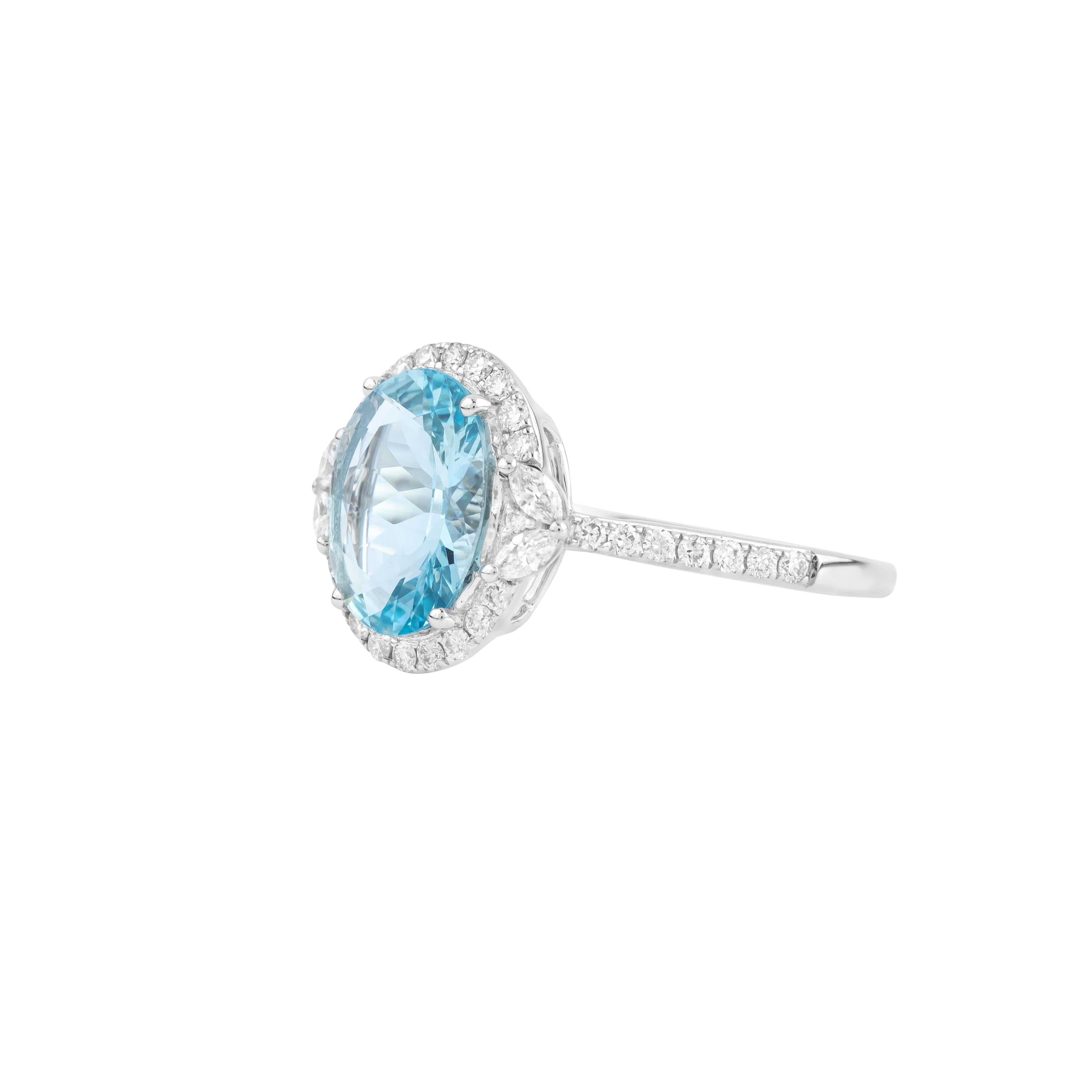 A bold expression of contemporary elegance, the 18 Karat Gold 2 Carat Diamond and Aquamarine Modern Fashion Ring combines cutting-edge design with timeless luxury. At its center, a striking aquamarine commands attention with its captivating