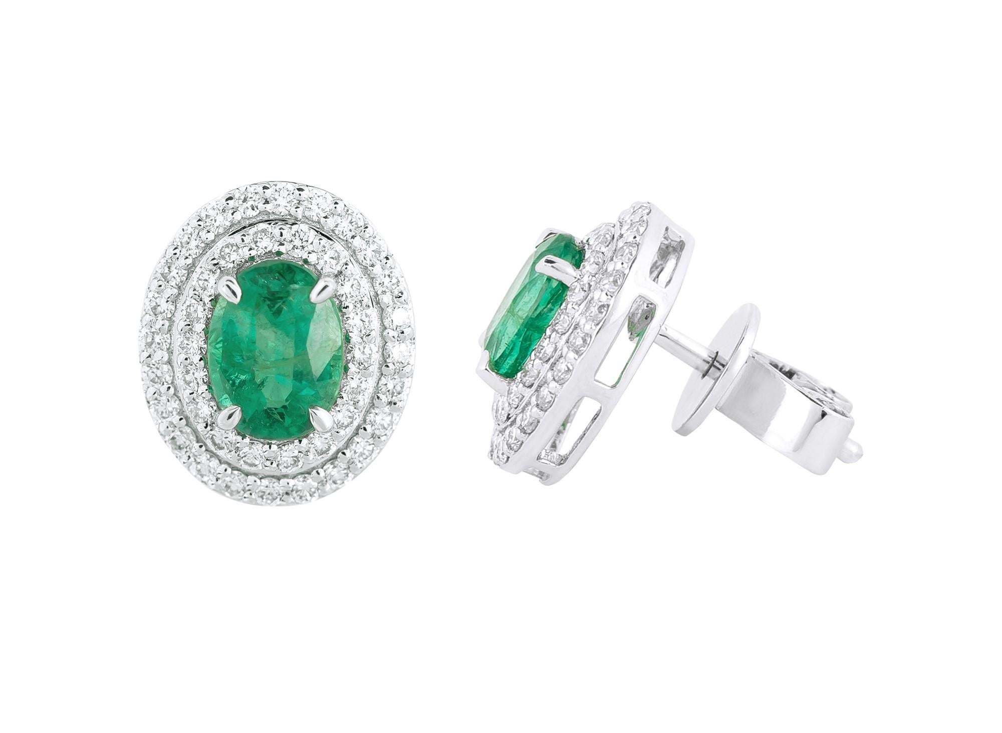 Unveil the grace and elegance of our 18 Karat Gold 2.04 Carat Diamond and Emerald Solitaire Stud Earrings. Crafted with precision and carefully curated, each pair represents a harmonious blend of traditional craftsmanship and contemporary