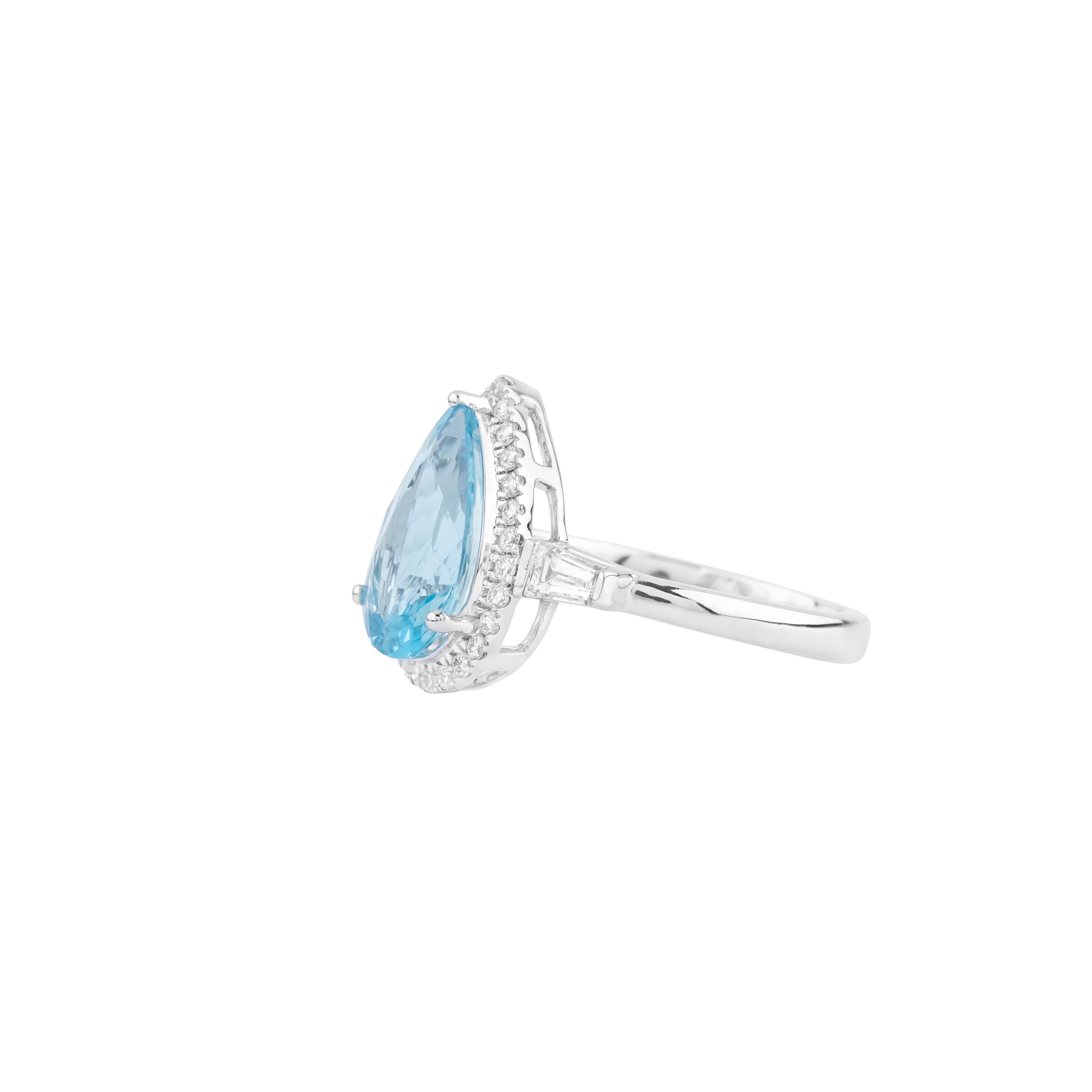 An exquisite blend of refined luxury and striking design, the 18 Karat Gold 2.17 Carat Diamond and Aquamarine Cocktail Ring is a perfect union of craftsmanship and artistry. At its heart lies a mesmerizing 2.17 carat aquamarine, radiating a serene