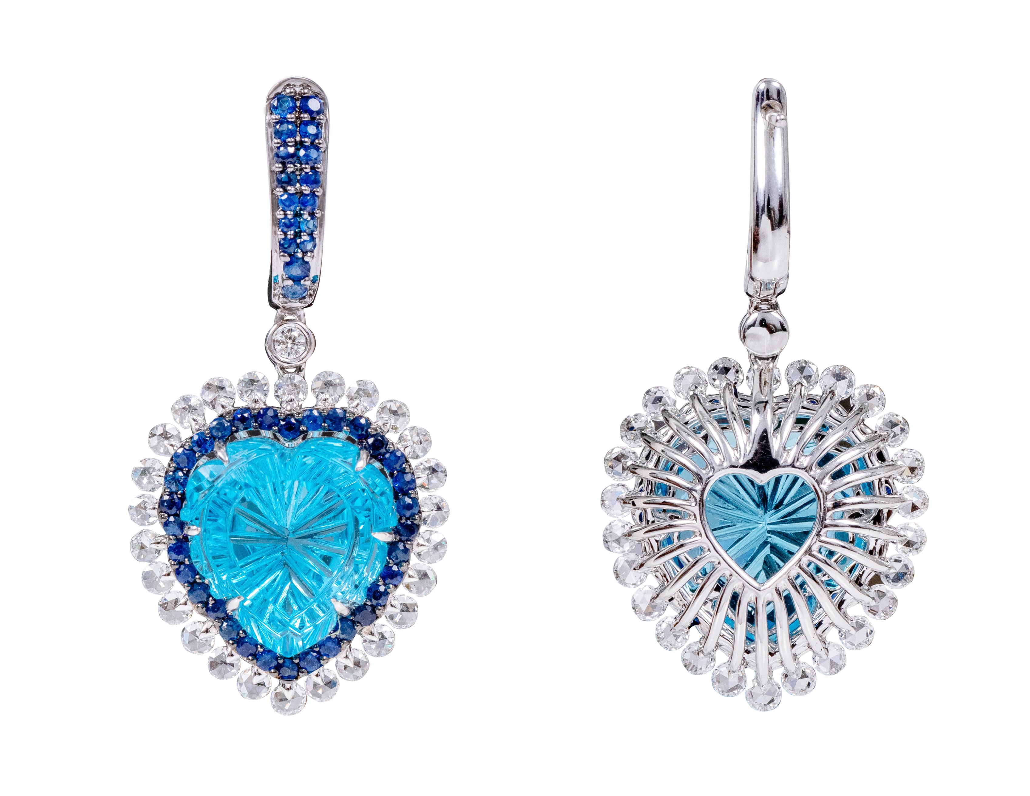 18 Karat Gold 23.67 Carat Diamond, Blue-Topaz, and Sapphire Heart-Shape Drop Cocktail Earrings

This impeccable swiss blue topaz, royal blue sapphire and diamond rose-cut earring is sensational. The earring sets itself apart with the exquisite
