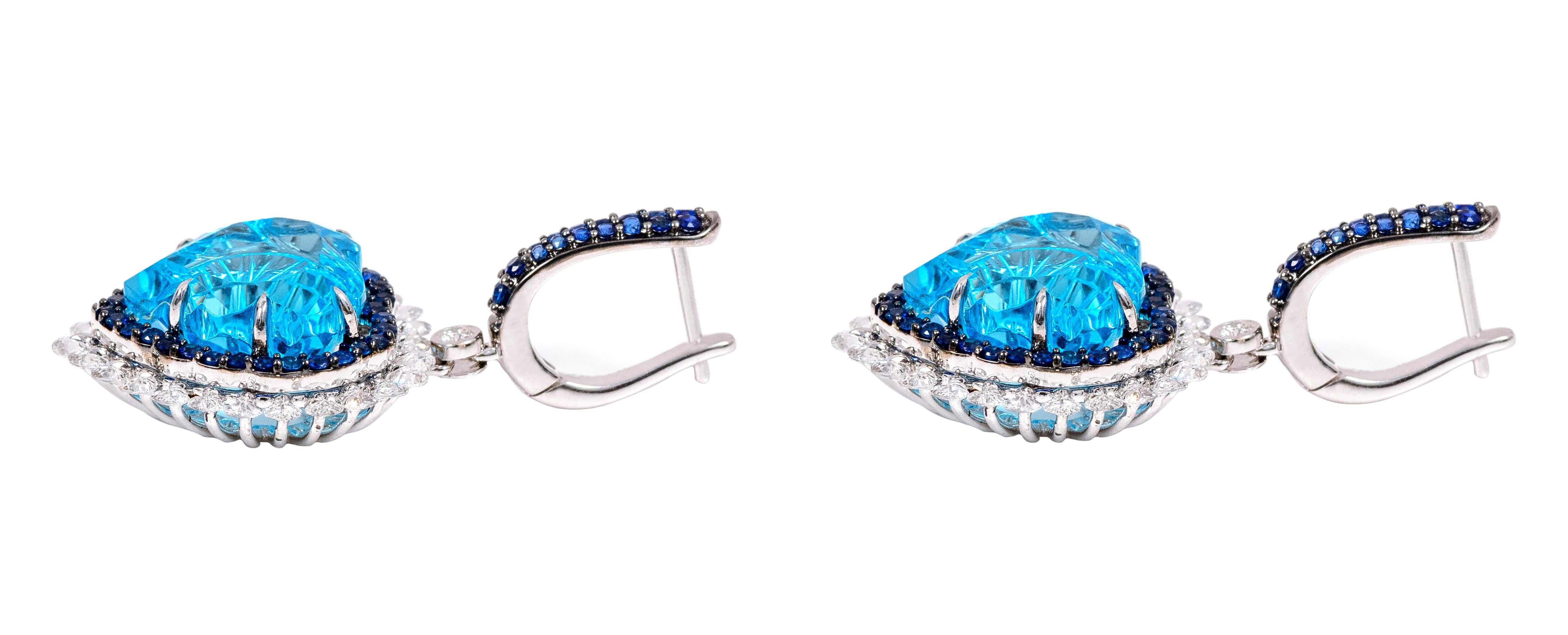 Contemporary 18 Karat Gold 23.67 Carat Diamond, Blue-Topaz, and Sapphire Heart-Shape Earrings For Sale