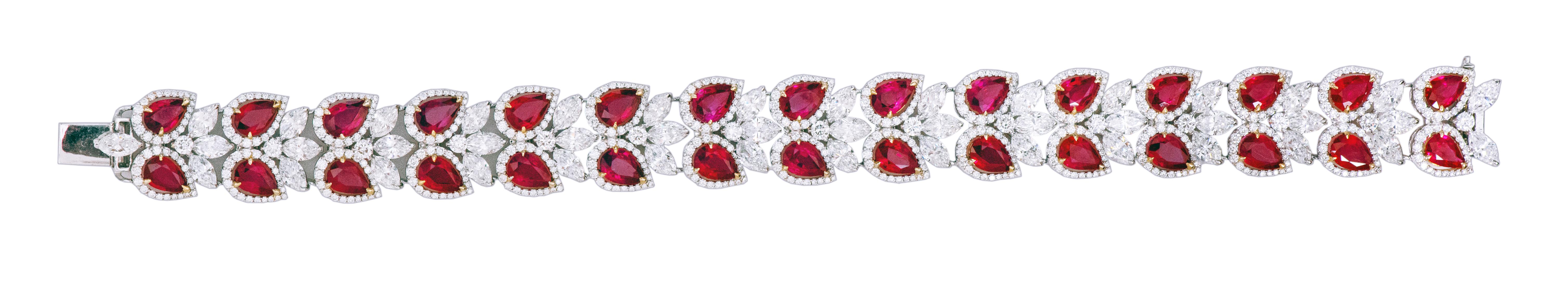 18 Karat Gold 26.22 Carat Ruby and Diamond Cocktail Statement Tennis Bracelet

This incredulous blood-red ruby and diamond solitaire broad flexible bracelet is impressive. The solitaire pear-shaped ruby is surrounded by a single row of slightly