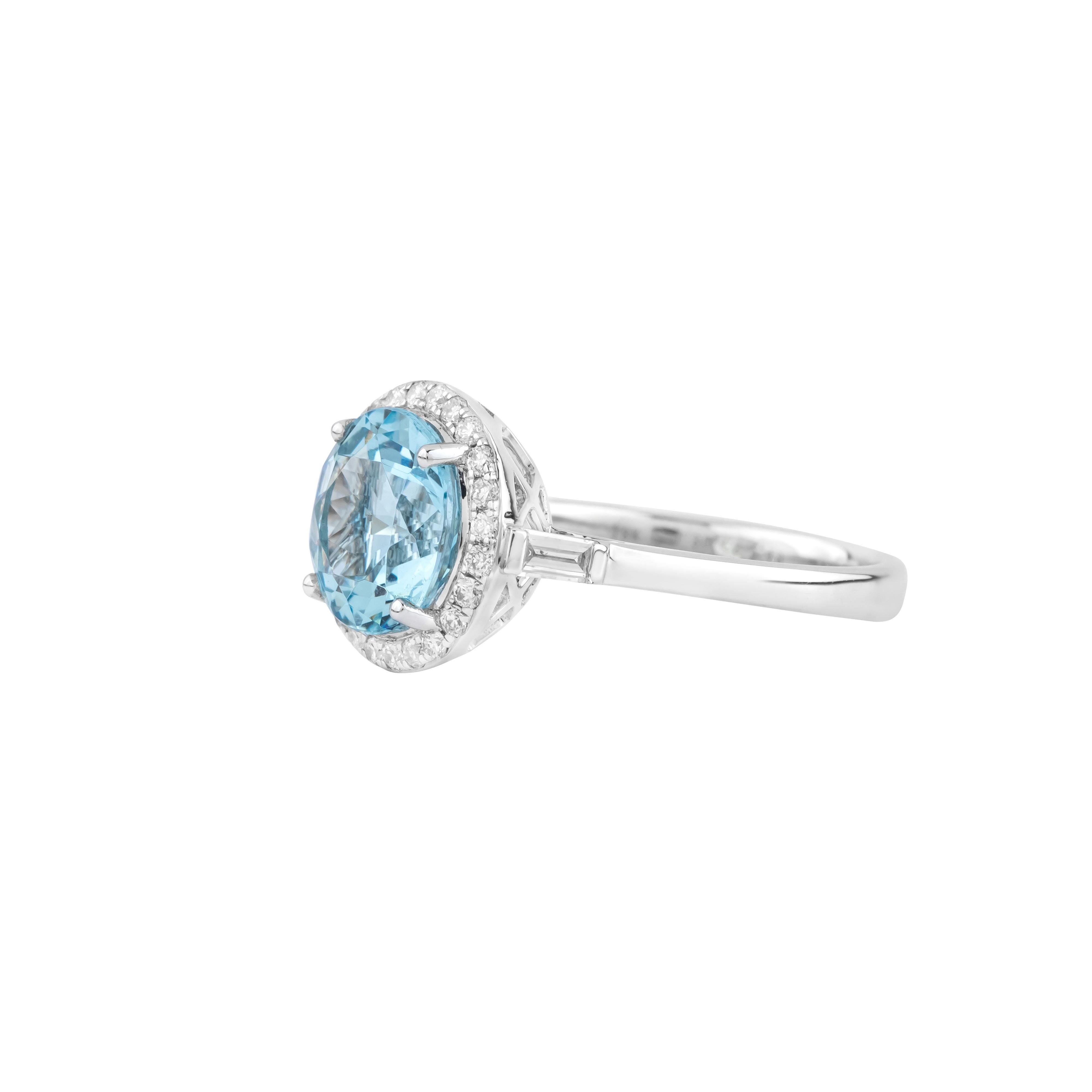 A captivating symbol of refined elegance, the 18 Karat Gold 2.79 Carat Diamond and Aquamarine Solitaire Ring exudes a timeless appeal with its harmonious design. Showcasing a radiant 2.79 carat aquamarine, this solitaire ring captures light with