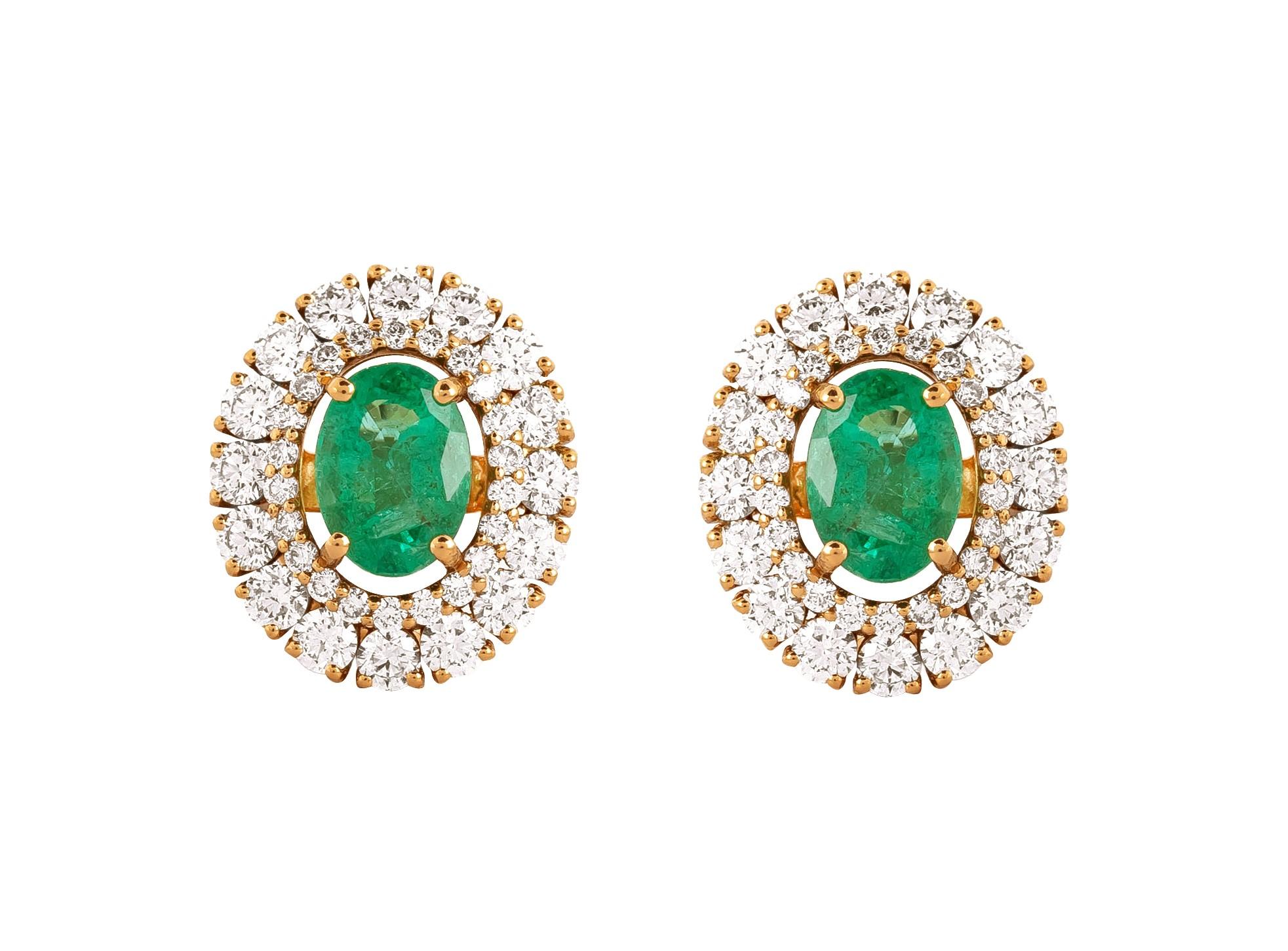 Enter the world of refined elegance with our 18 Karat Gold 2.79 Carat Diamond and Emerald Solitaire Stud Earrings. Each piece stands as a testament to exquisite craftsmanship and meticulous curation, seamlessly blending tradition with modern