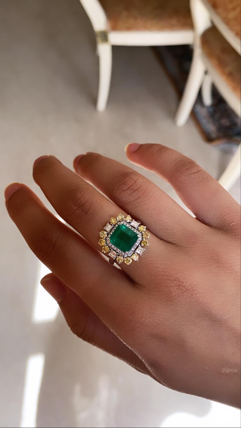 A very beautiful and wearable Emerald & Yellow Diamonds Cocktail Ring set in 18K White Gold. The Emerald weighs 2.79 carats and is of Zambian origin. The Emerald is completely natural, without any treatment & is octagonal in shape. The combined