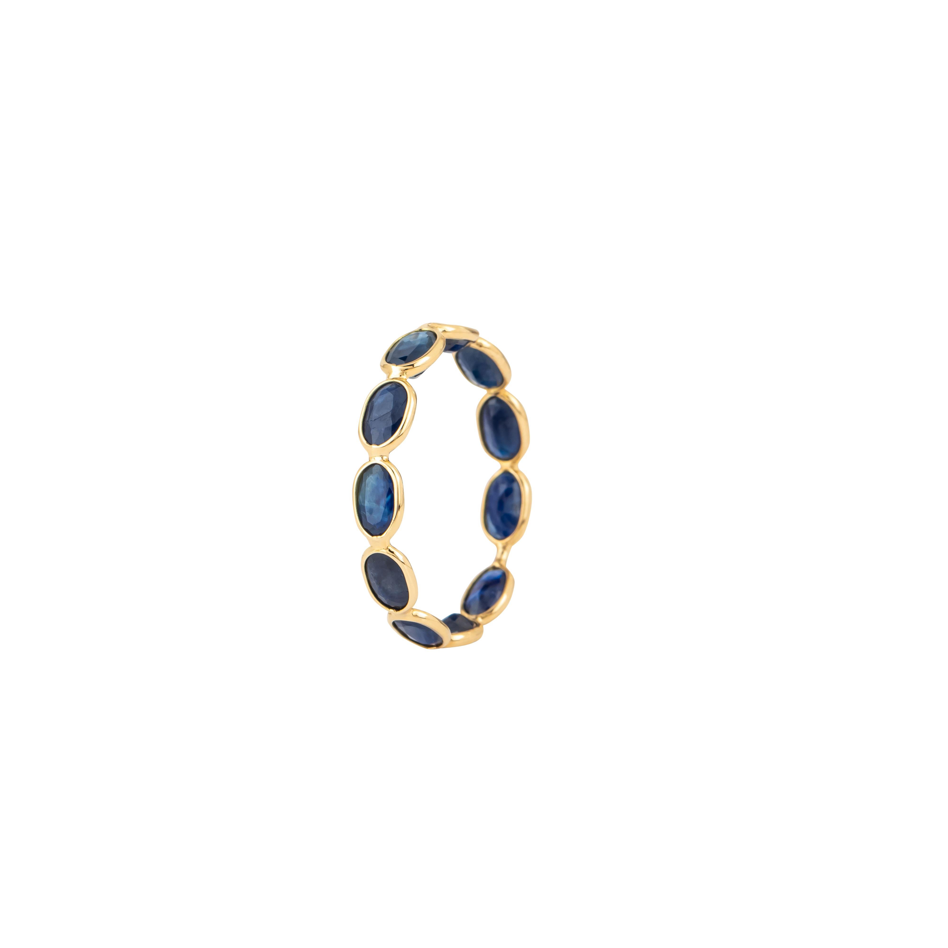 The 18 Karat Gold 3.2 Carat Sapphire Band Ring is a striking embodiment of elegance and timeless design. Showcasing 3.2 carats of meticulously selected sapphires, this band ring exudes a sense of refined luxury. The sapphires, known for their rich
