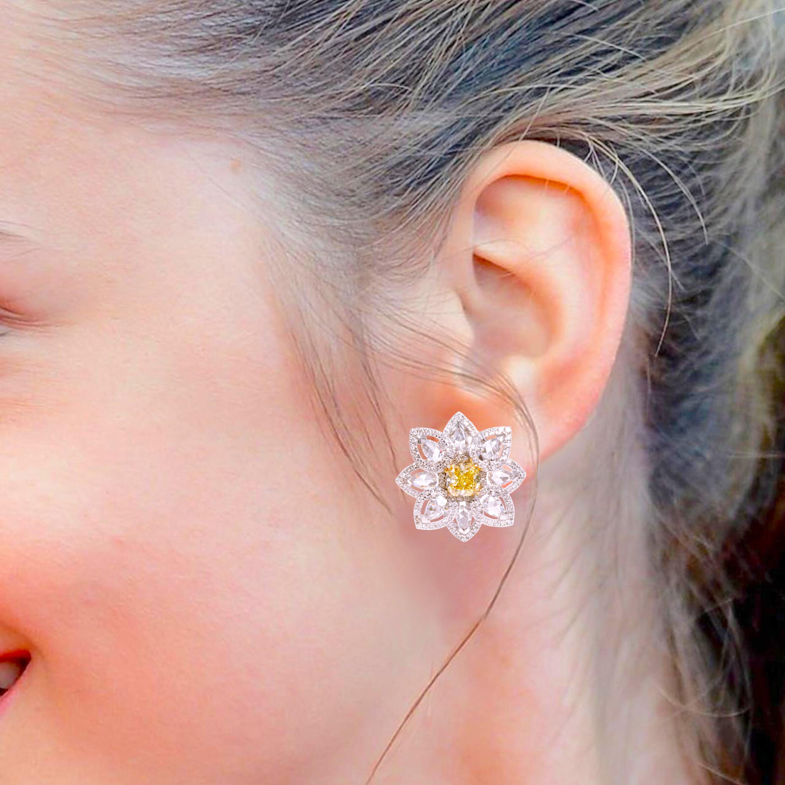 18 Karat Gold 3.36 Carat Yellow and White Diamond Modulation Stud Earrings

Flowers are meant to fill our live with freshness and beauty. They symbolize love and to cherish that with showers of love we bring to you a craft of finesse that brings out