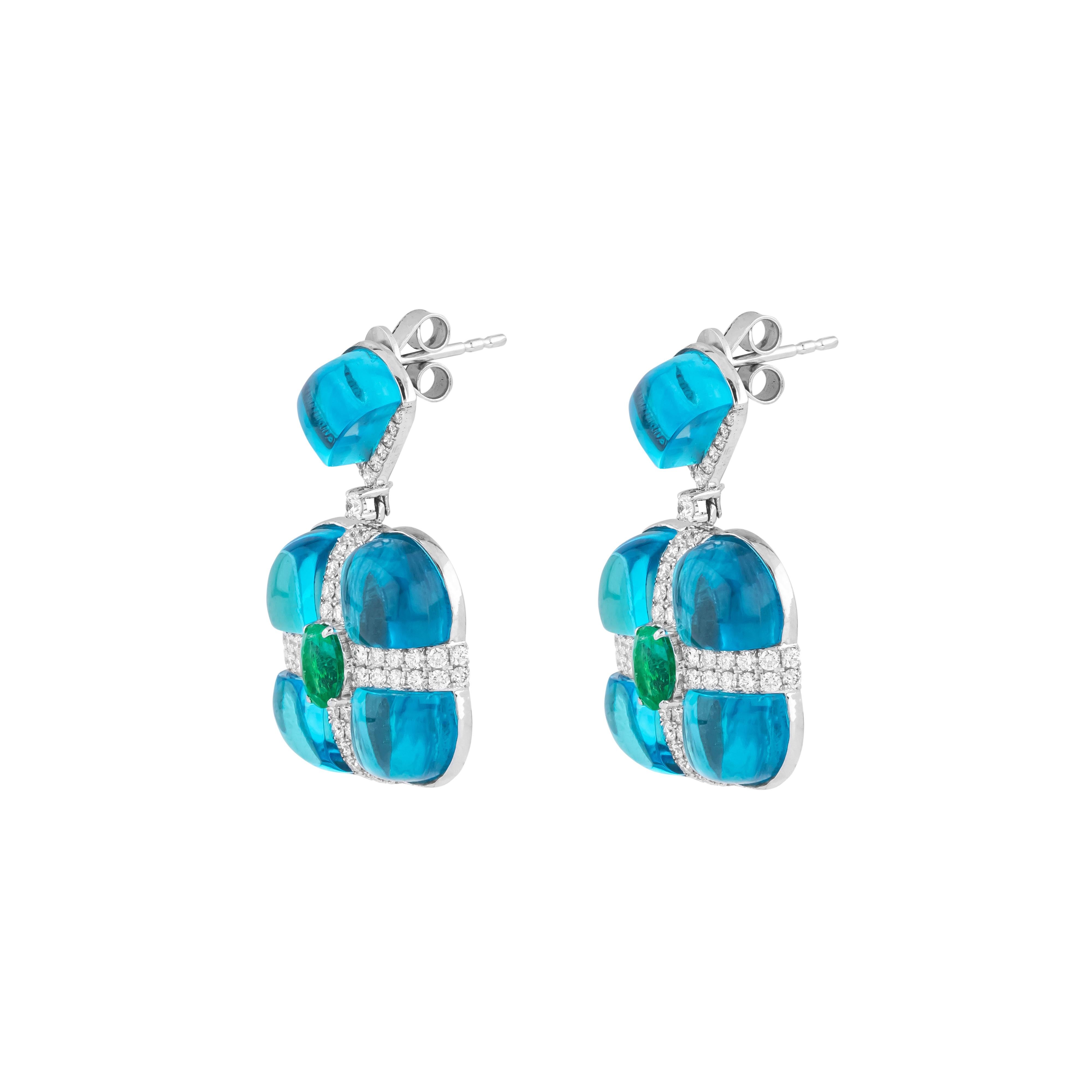 El diseño opulento y la maestría artesanal convergen en los Pendientes Gota de Diamante, Esmeralda y Topacio Azul de 33,9 Quilates de Oro de 18 Kilates. Cada pieza está elaborada y curada de forma única, garantizando una mezcla de elegancia y