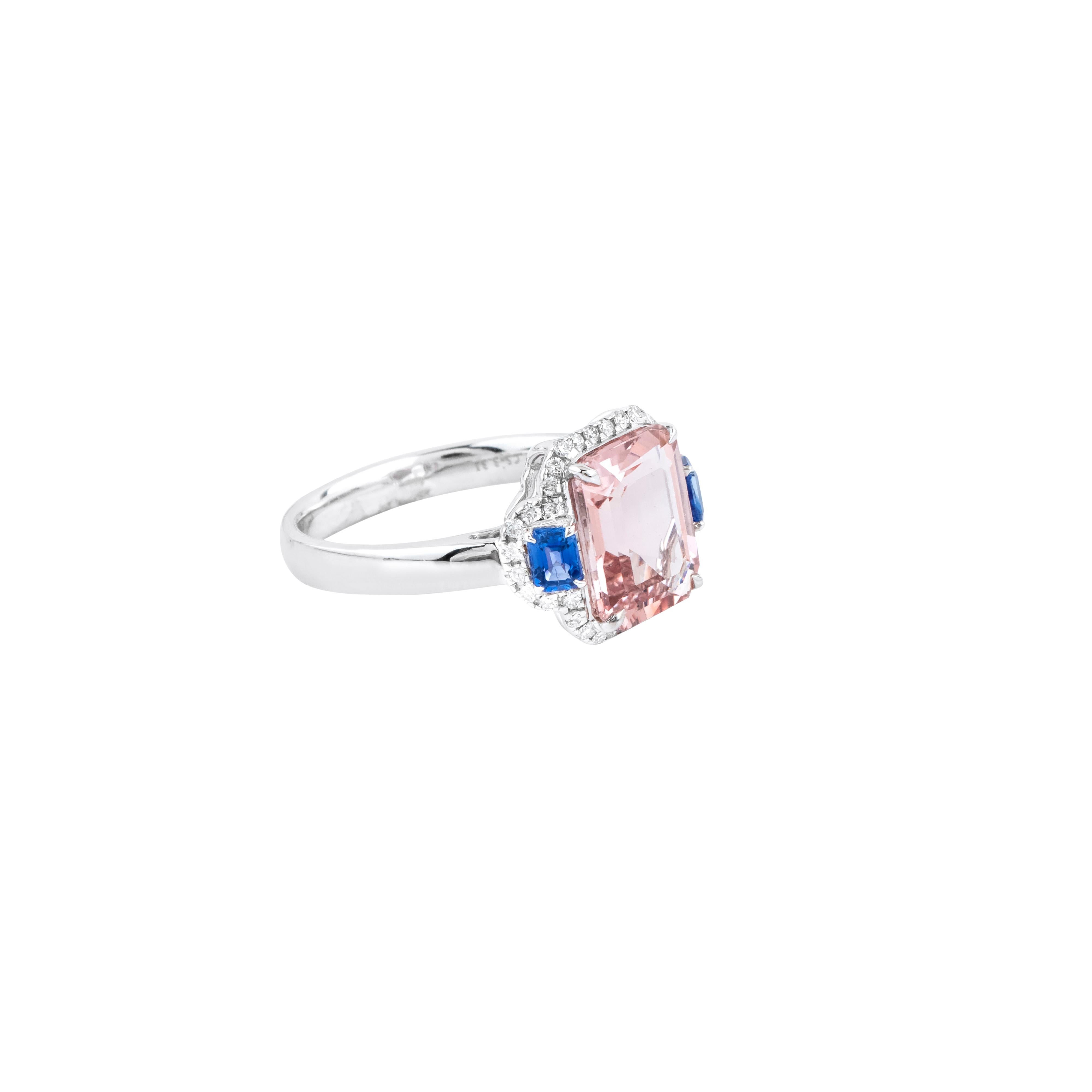 Exquisite craftsmanship meets luxurious design in the 18 Karat Gold 3.48 Carat Diamond, Sapphire, and Morganite Fashion Ring. This captivating piece seamlessly blends timeless elegance with modern sophistication, offering a harmonious fusion of