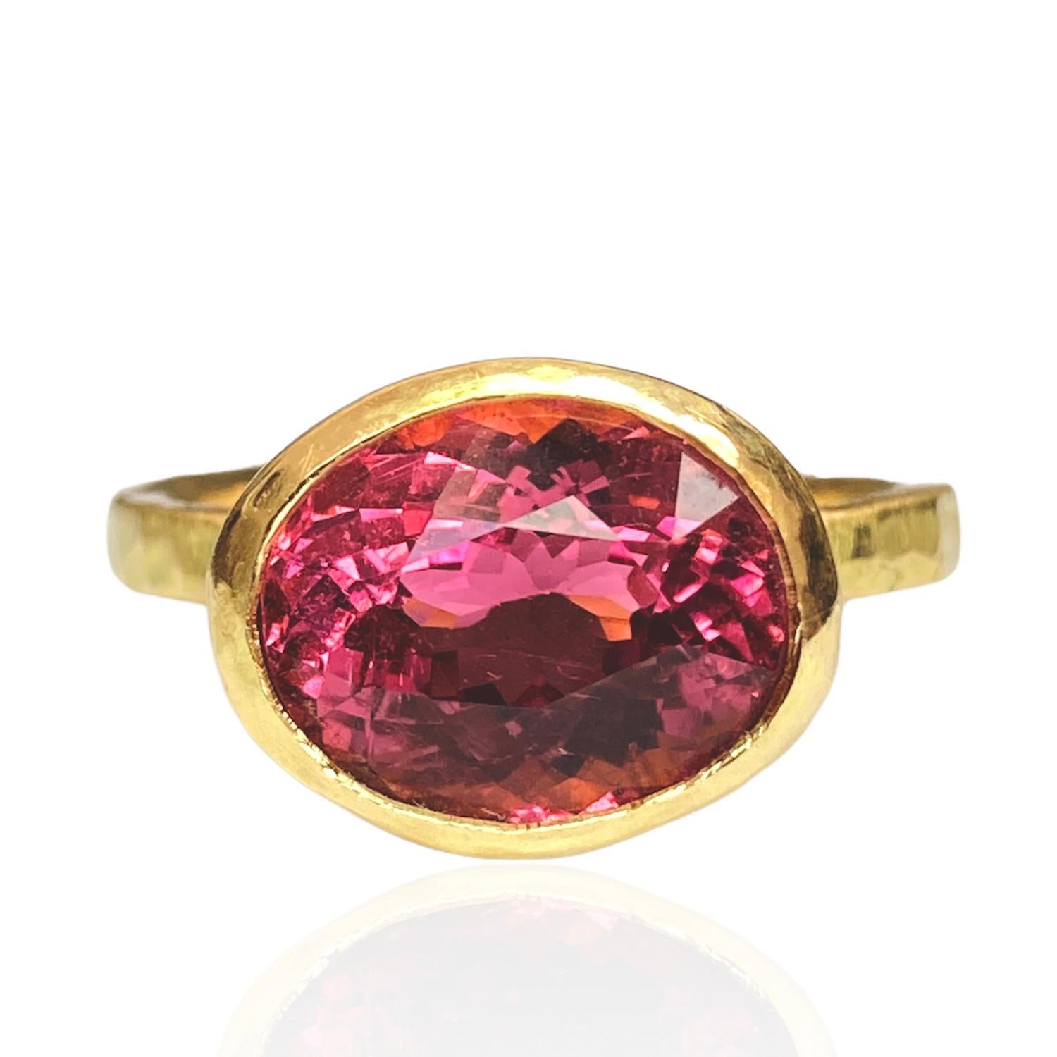 18 Karat Yellow Gold Ring by Deborah Murdoch is from the Abundance Collection featuring an oval 3.76ct Natural African Hot Pink Tourmaline Stone. The ring band is slightly planished giving that textural feel and has a silky satin finish. 

Metal: 18