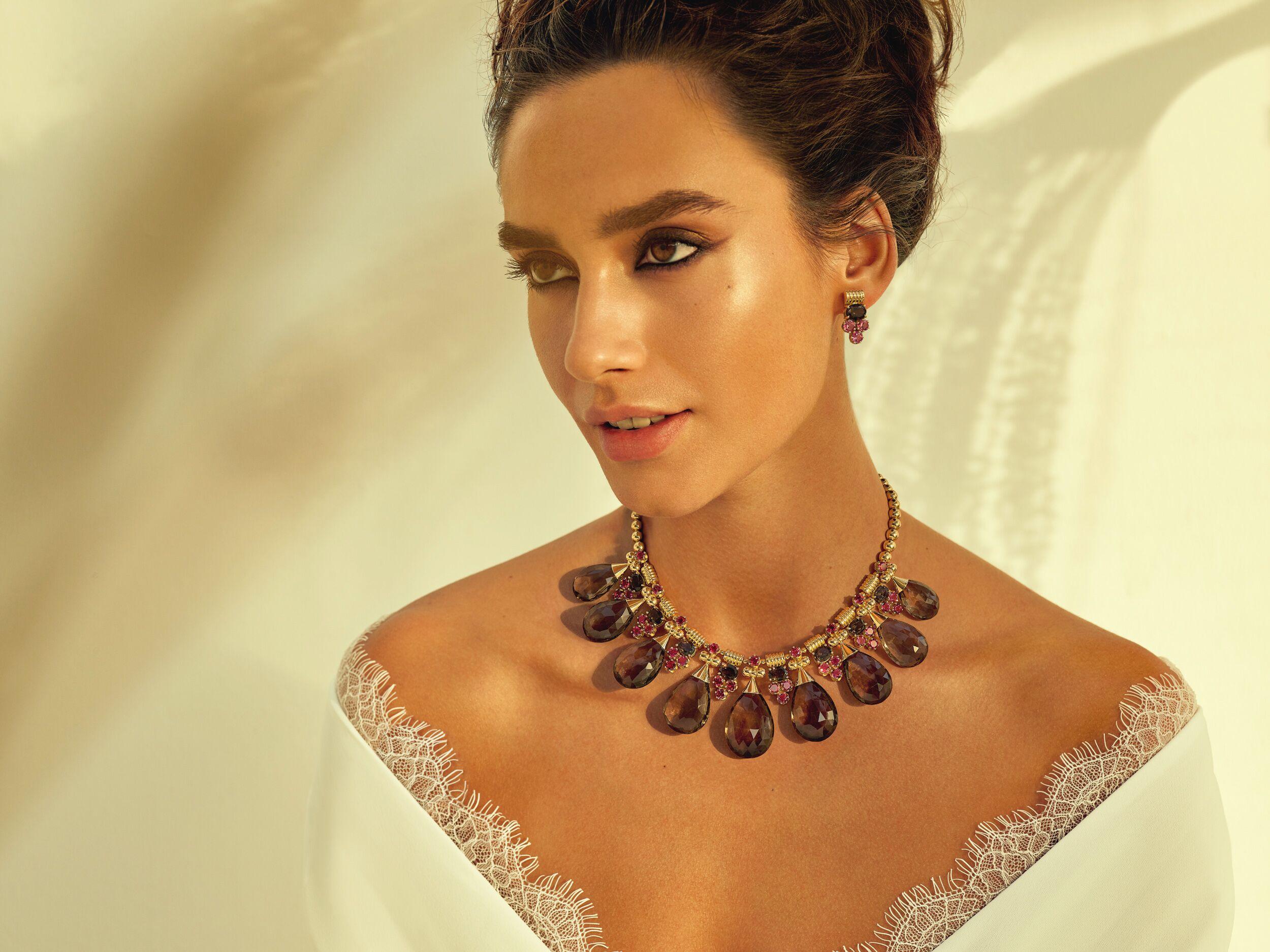 18 Karat Gold, 389.60 carat faceted, Pear-shaped Smokey Topaz and 16.50 carat Round-cut Pink Tourmaline Statement Drop-shaped Necklace from Azza Fahmy's Gypsy collection.

Celebrating the unique, nomadic Amazigh tribes people of Northern Africa,