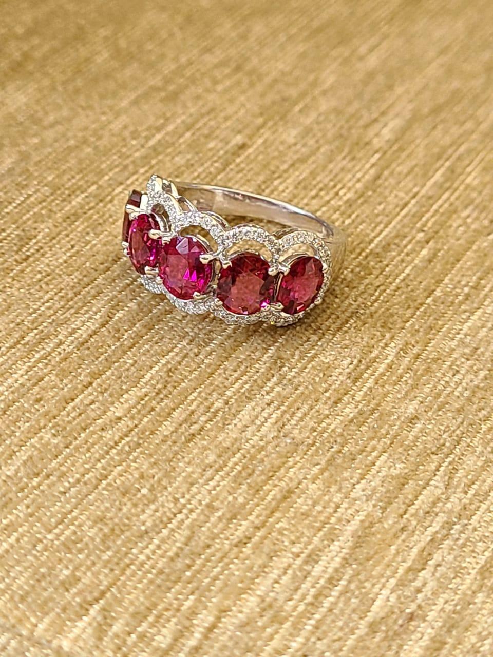 A very wearable Rubellite and Diamonds Band Ring set in 18K Gold & Diamonds. The weight of the Rubellite is 4.03 carats. The Rubellite is completely natural, without any treatment. The weight of the diamonds is 0.42 carats. The dimensions of the