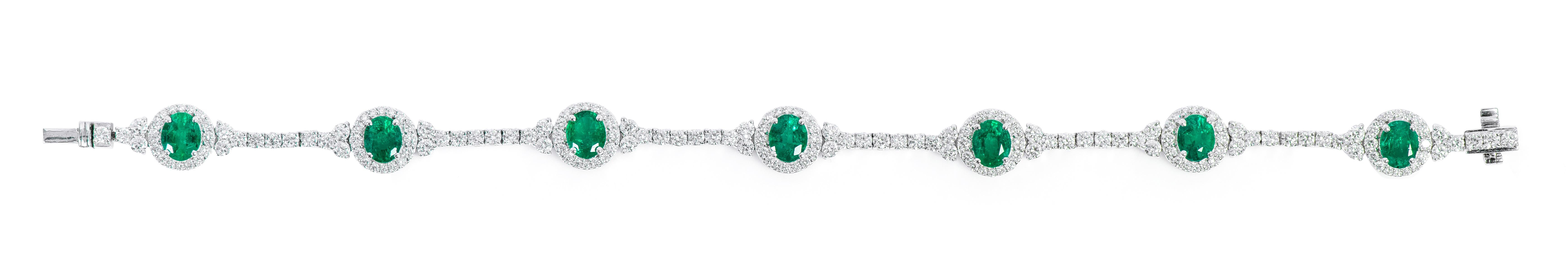18 Karat White Gold 4.17 Carat Natural Emerald and Diamond Cluster Tennis Bracelet

This impeccable diamond solitaire and forest green emerald tennis bracelet is special. The diamond round solitaires in a 4-prong setting form the core of the