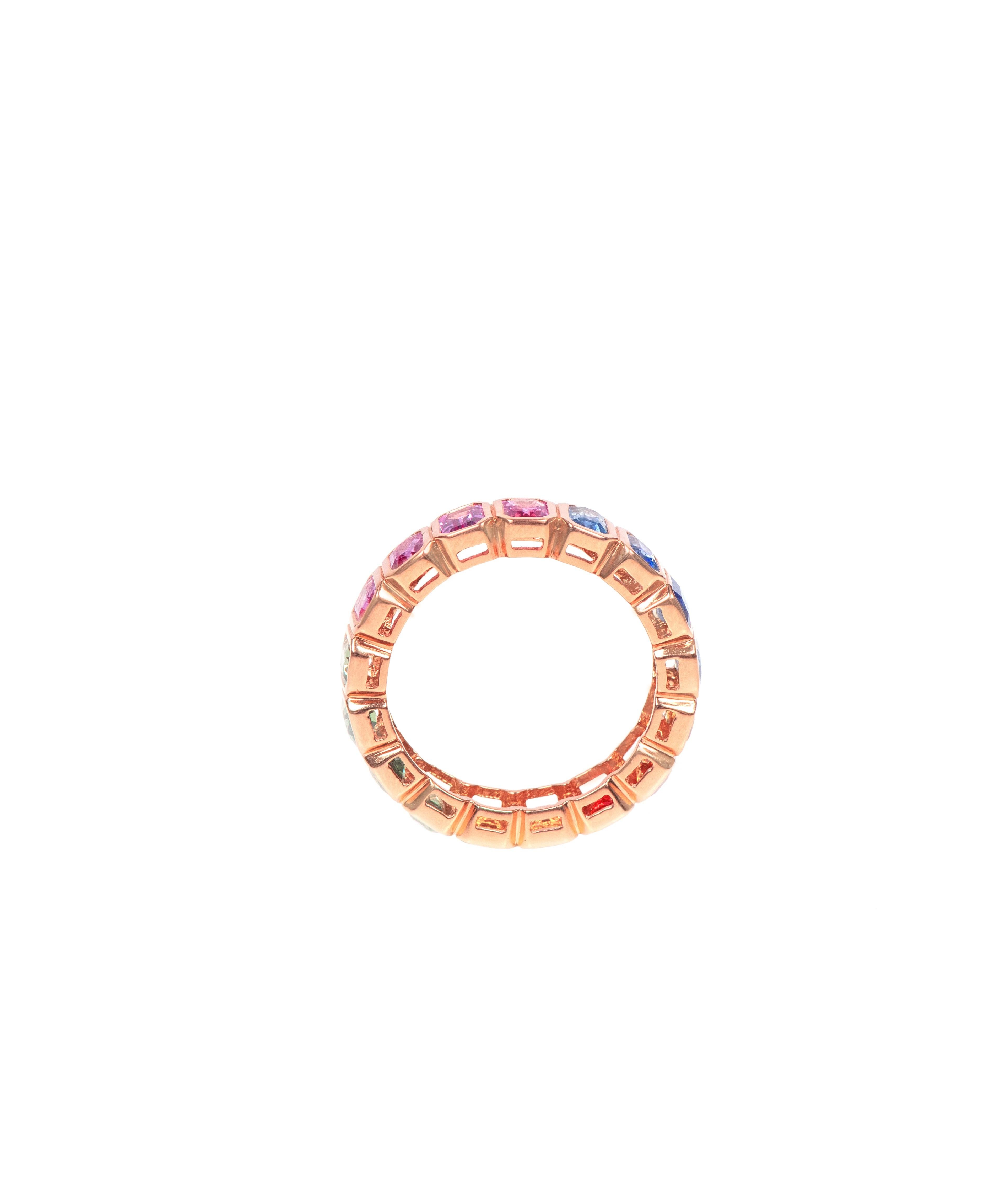 Indulge in the timeless beauty of our 18 Karat Gold 4.19 Carat Multi-Sapphire Eternity Band Ring. This exquisite ring is adorned with a mesmerizing array of multi-colored sapphires, totaling 4.19 carats, elegantly set in an eternity band design.