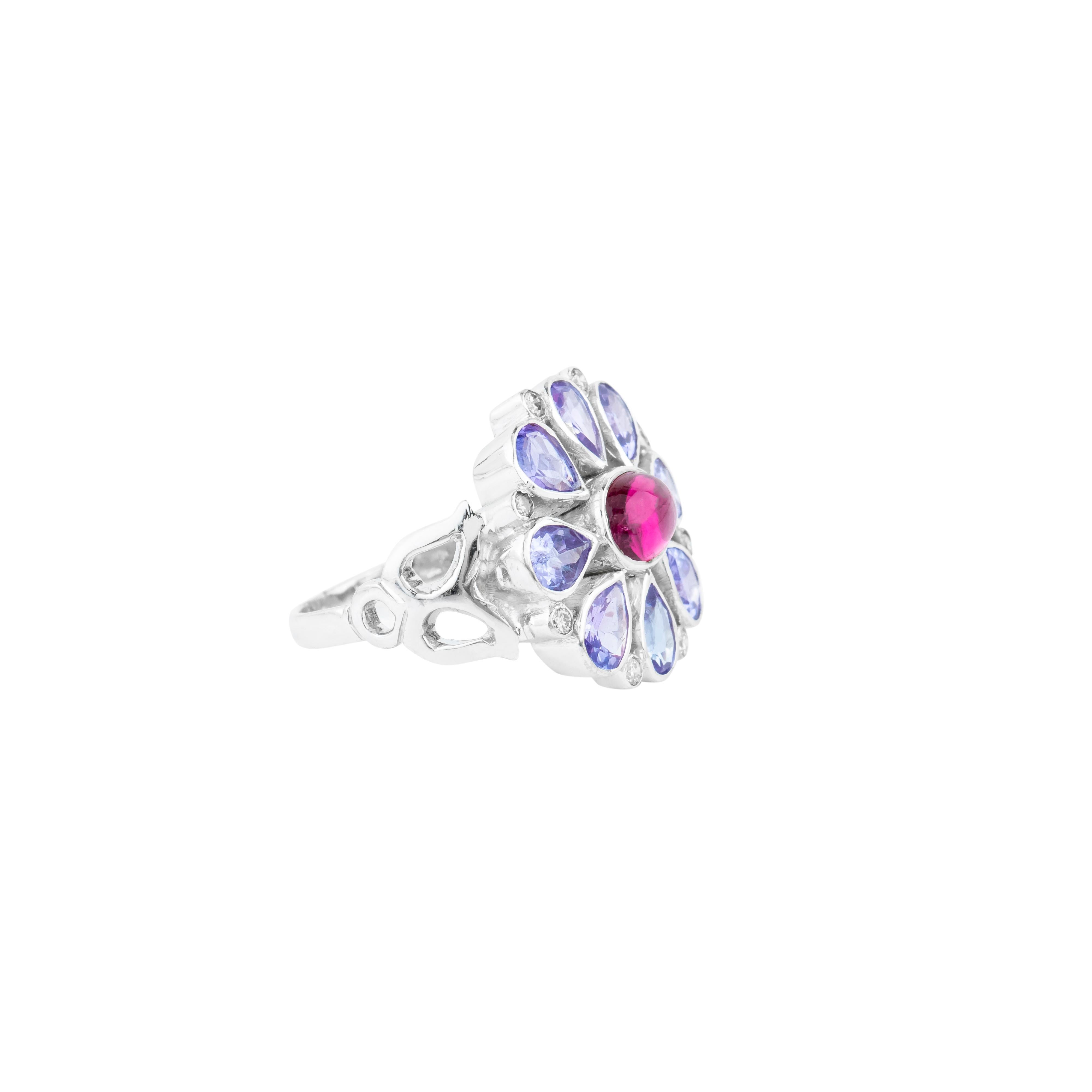 This 18 Karat Gold cocktail ring showcases a 4.22-carat color stone as its centerpiece, a gem of remarkable vibrancy and depth. Expertly faceted to enhance its brilliance, the stone is secured in an elegant prong setting, allowing it to captivate