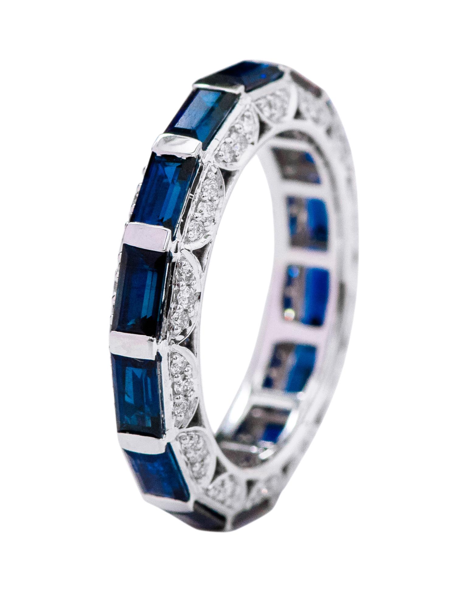18 Karat White Gold 4.45 Carat Baguette-Cut Sapphire and Diamond Eternity Band Ring

This marvelous royal blue sapphire and side diamond band is alluring. The solitaire vertically placed baguette-emerald cut sapphires in half-bezel white gold