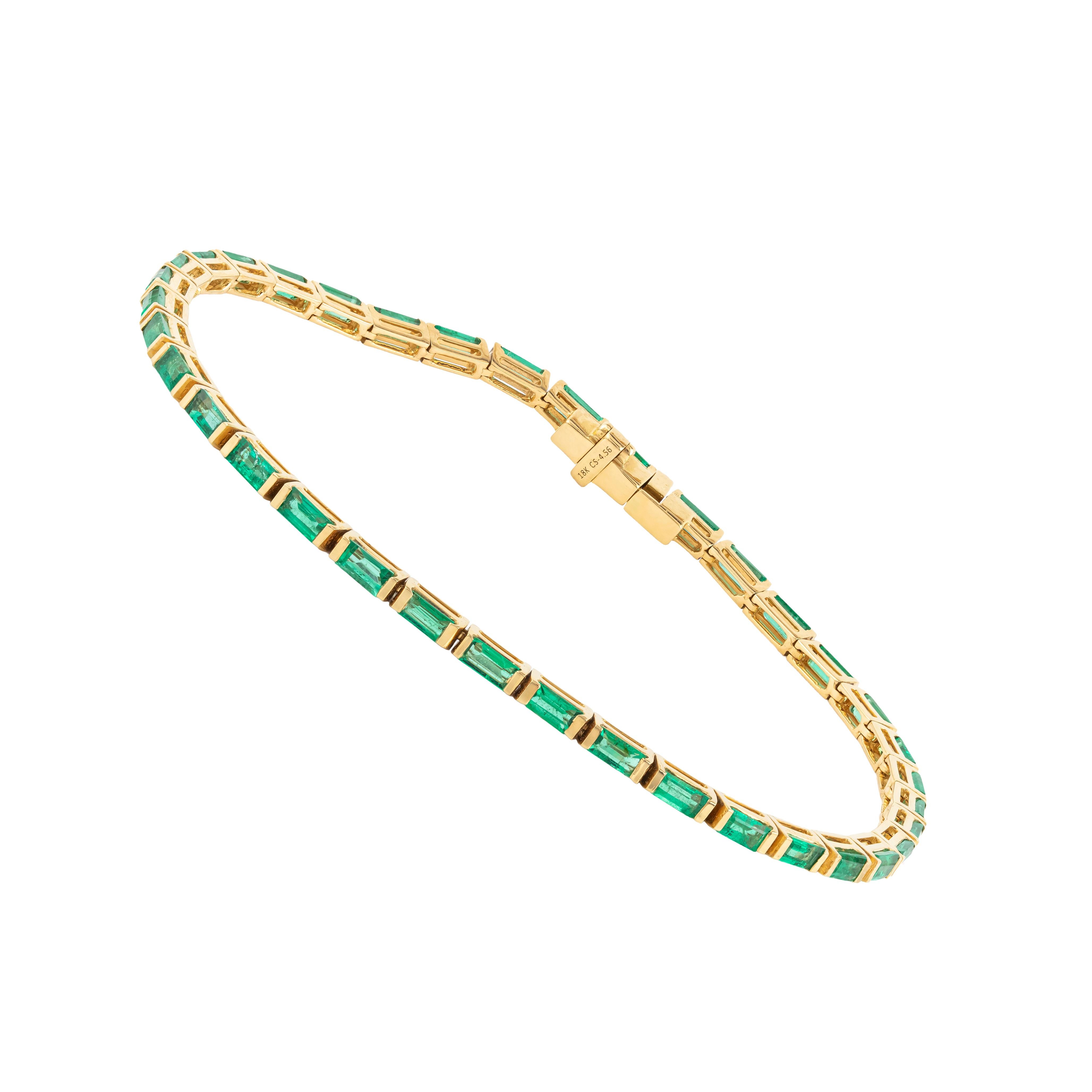 A masterpiece of refined elegance, this 18 Karat Gold Tennis Bracelet features 4.56 carats of carefully curated emeralds. Each gemstone is precisely cut to maximize its brilliance, creating a seamless cascade of vibrancy and sophistication. The