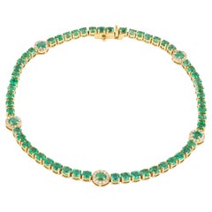 Bracciale tennis in oro 18 carati con smeraldo e diamante da 4,73 carati