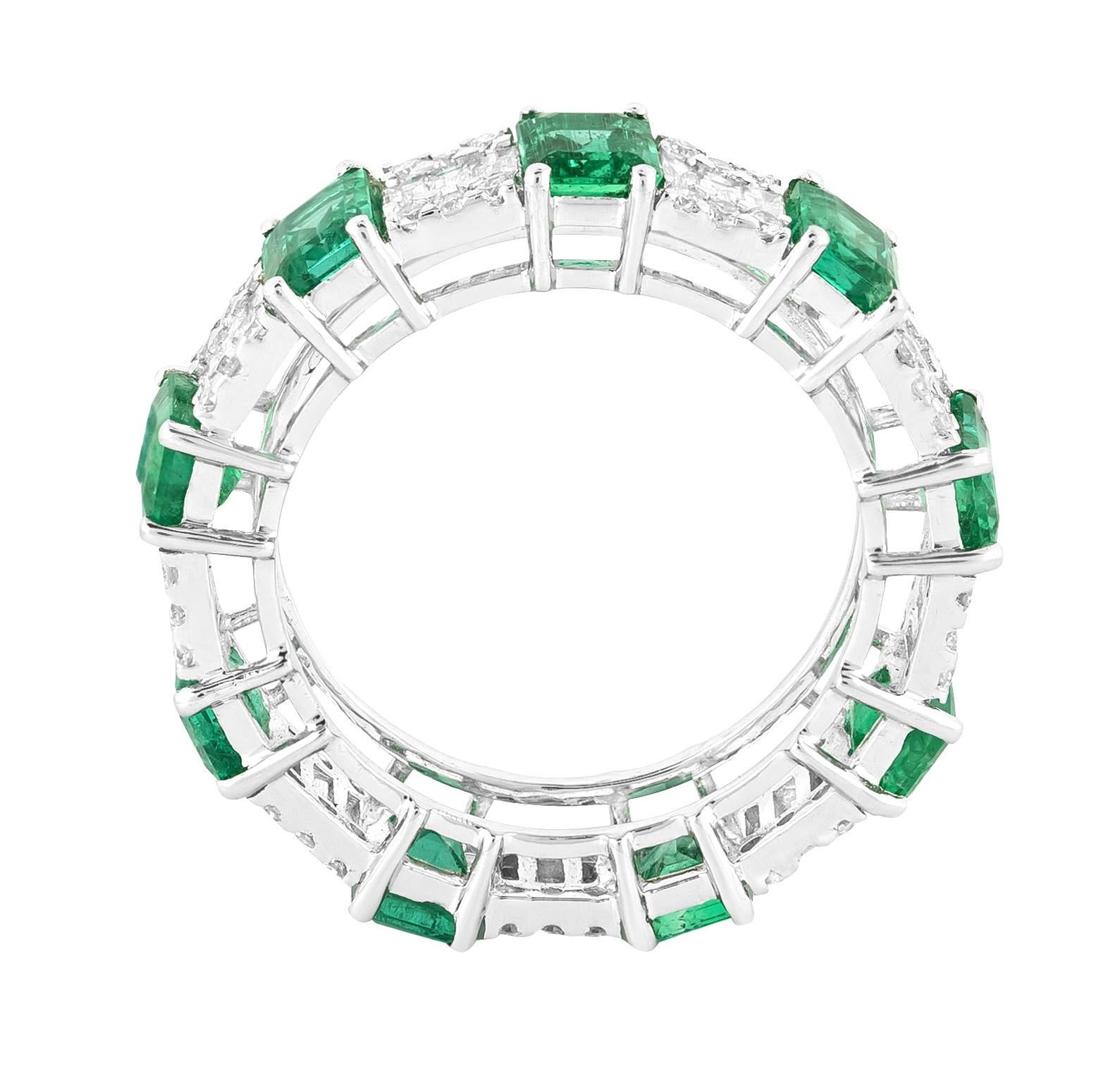 Crafted to epitomize eternal beauty and unmatched elegance, the 18 Karat Gold 5.02 Carat Diamond and Emerald Infinity Band Ring is a luminous amalgamation of sophistication and refinement. Each ring represents a harmonious blend of creativity and