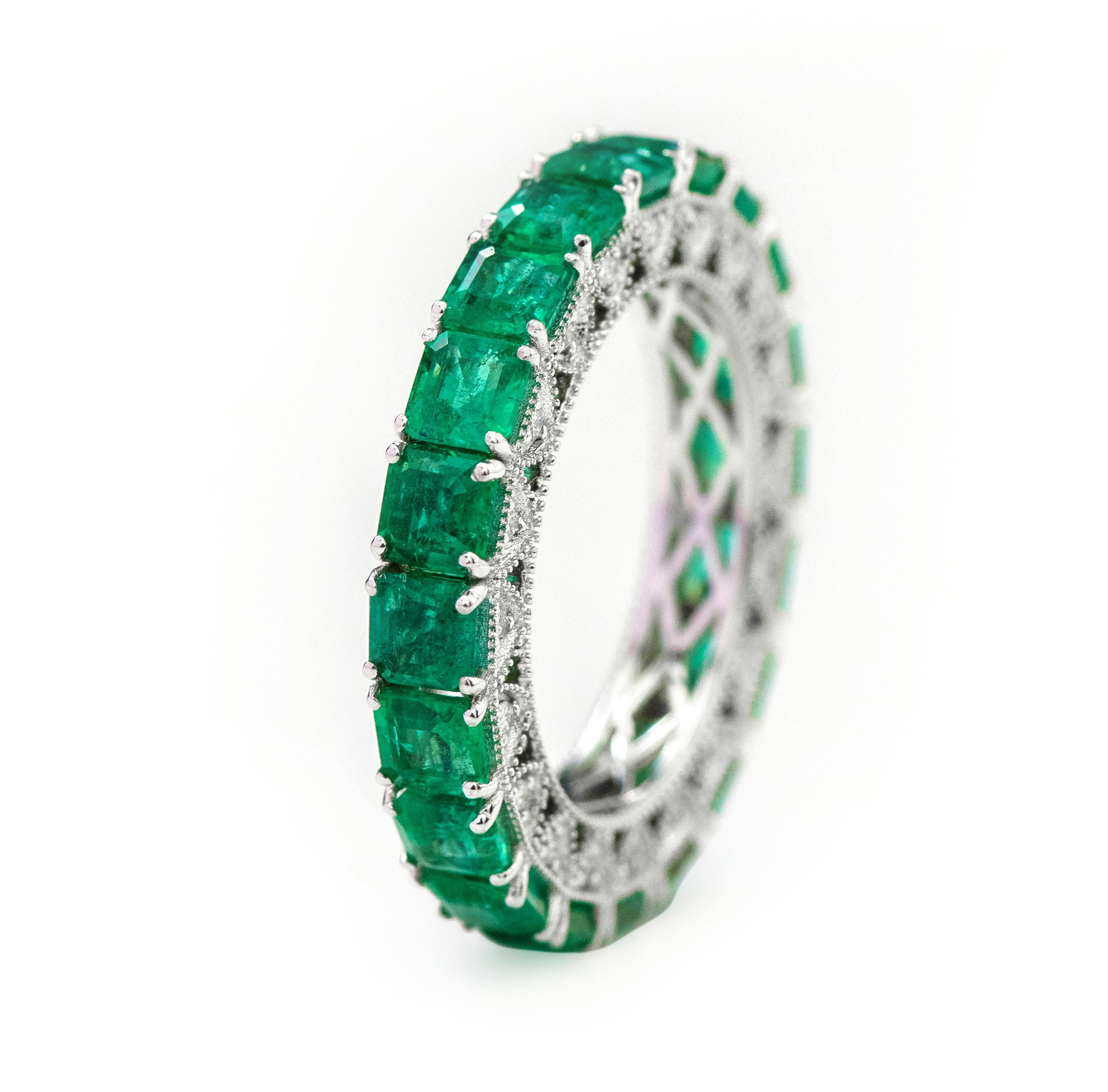 18 Karat White Gold 5.34 Carat Emerald-Cut Natural Emerald and Diamond Eternity Band Ring

This impressive parakeet green emerald and side diamond band is alluring. The solitaire vertically placed emerald-cut emeralds in grain prong white gold