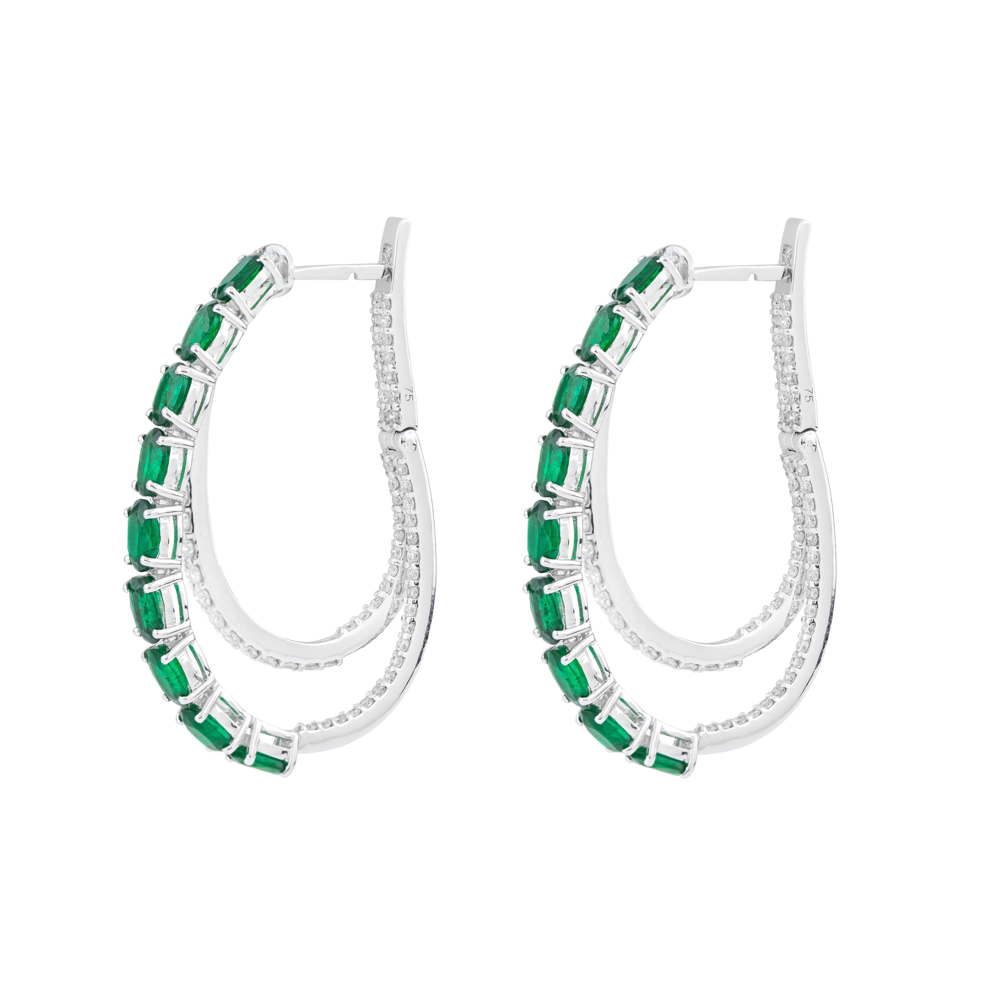 Elevate your ensemble with our exquisite 18 Karat Gold 5.4 Carat Diamond & Emerald Hoop Earrings, a fusion of timeless elegance and contemporary style. Each pair is meticulously crafted and curated to embody sophistication and individuality, making