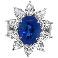 18 Karat Gold 5.48 Carat Oval Blue Sapphire 3.12 Carat Pear Shaped Diamond Ring